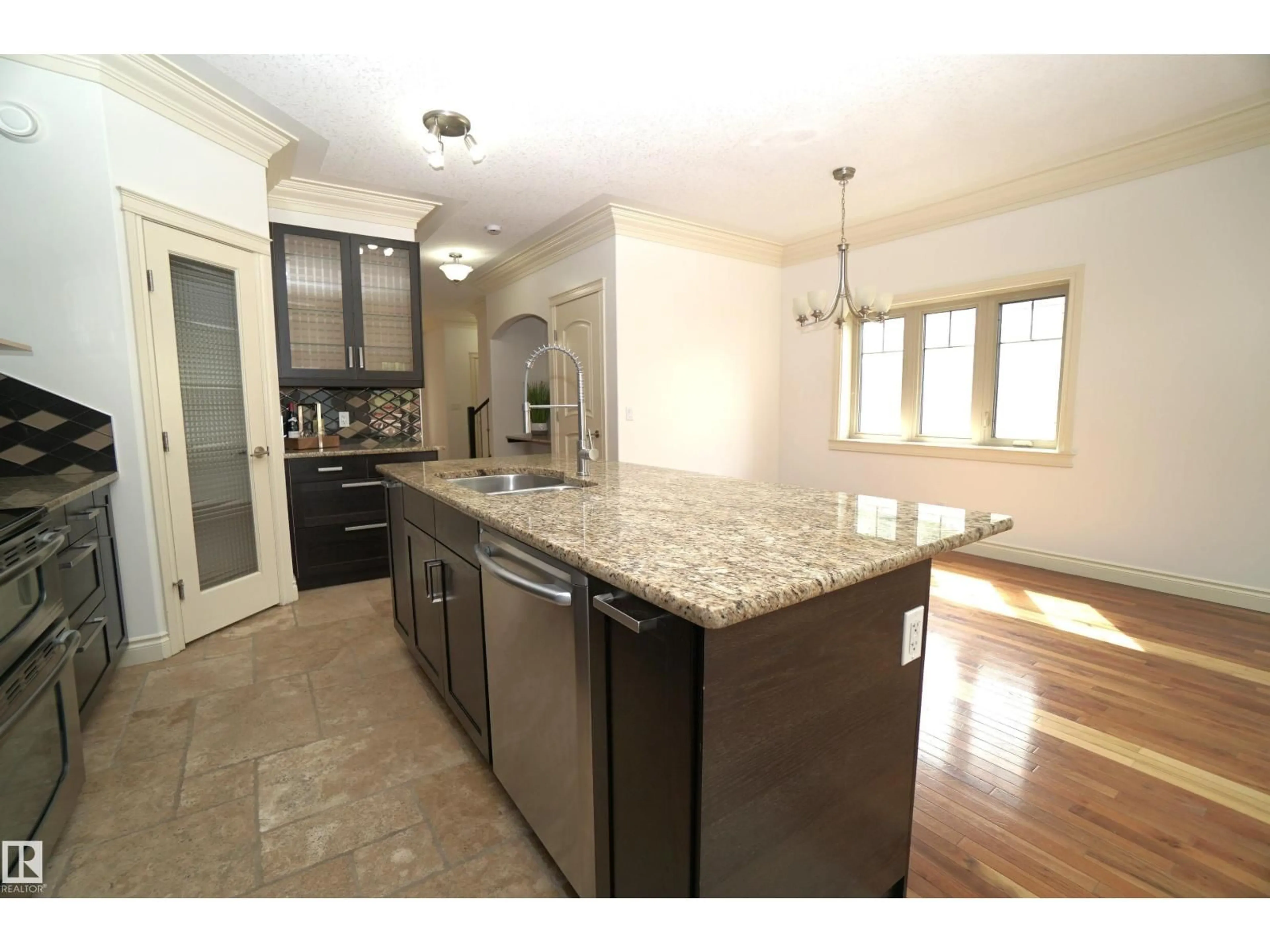 Open concept kitchen, ceramic/tile floor for 10224 90 ST, Edmonton Alberta T5H1S1