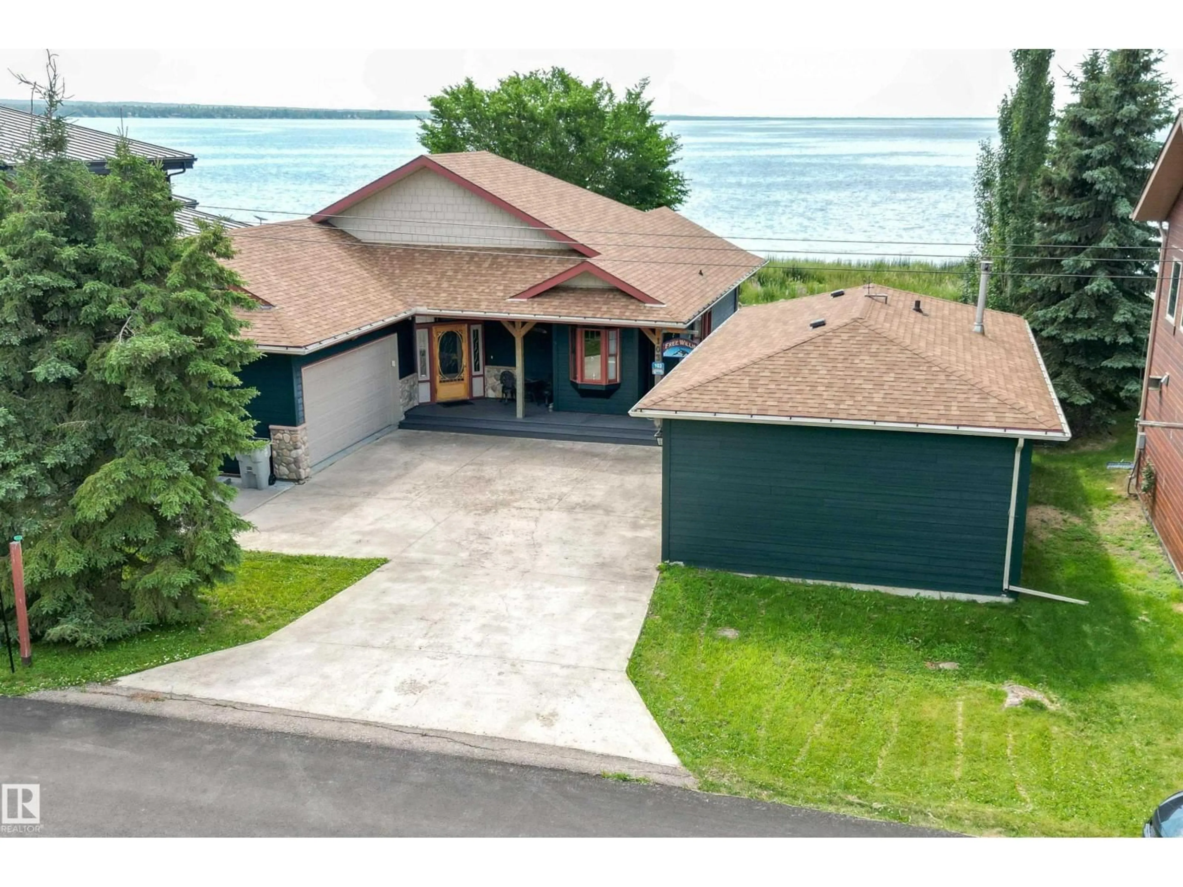 A pic from outside/outdoor area/front of a property/back of a property/a pic from drone, water/lake/river/ocean view for 103 ARGENTIA BEACH, Rural Wetaskiwin County Alberta T0C2C0