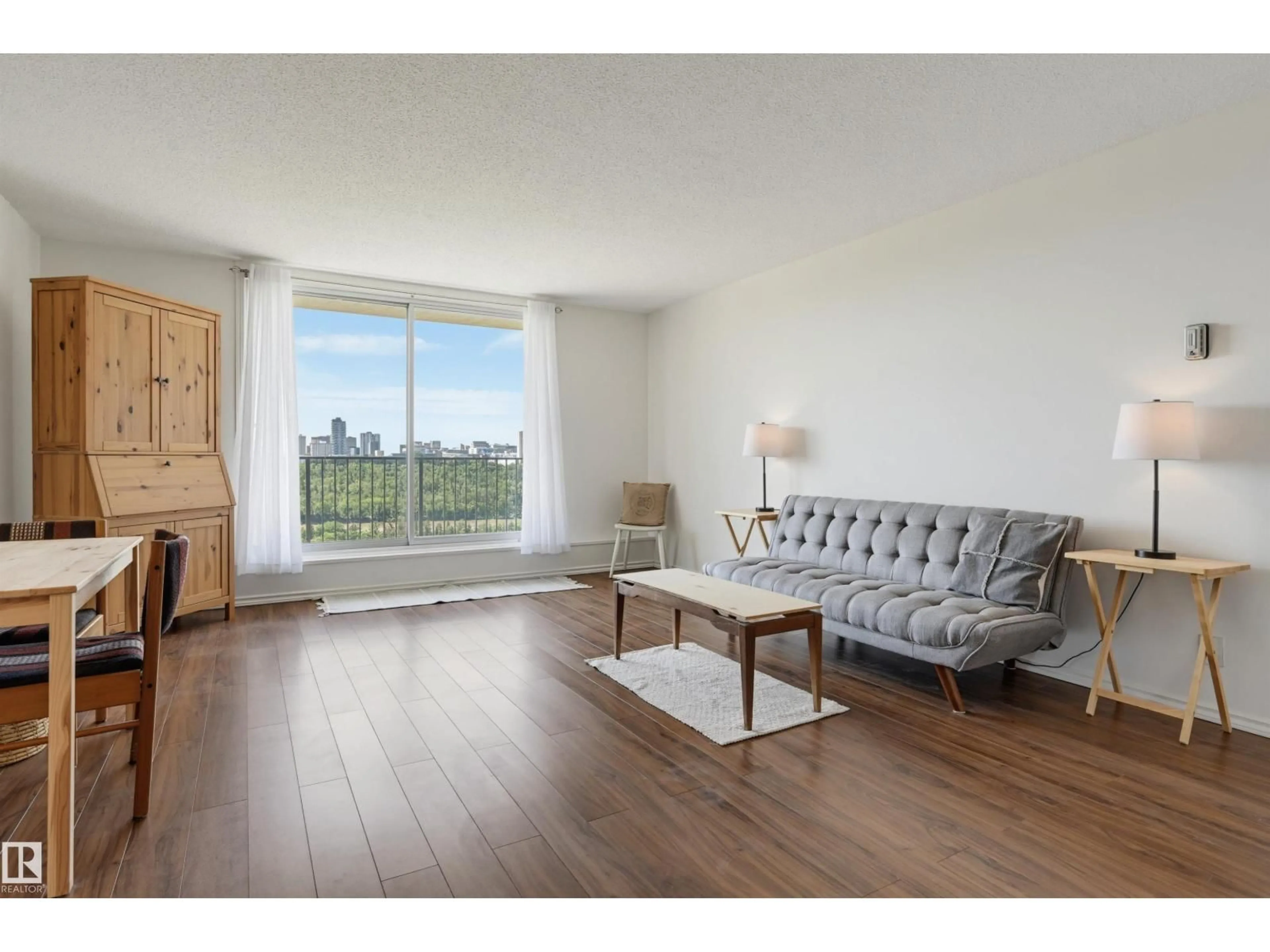 Living room with furniture, wood/laminate floor for 709 - 11307 99 AV, Edmonton Alberta T5K0H2
