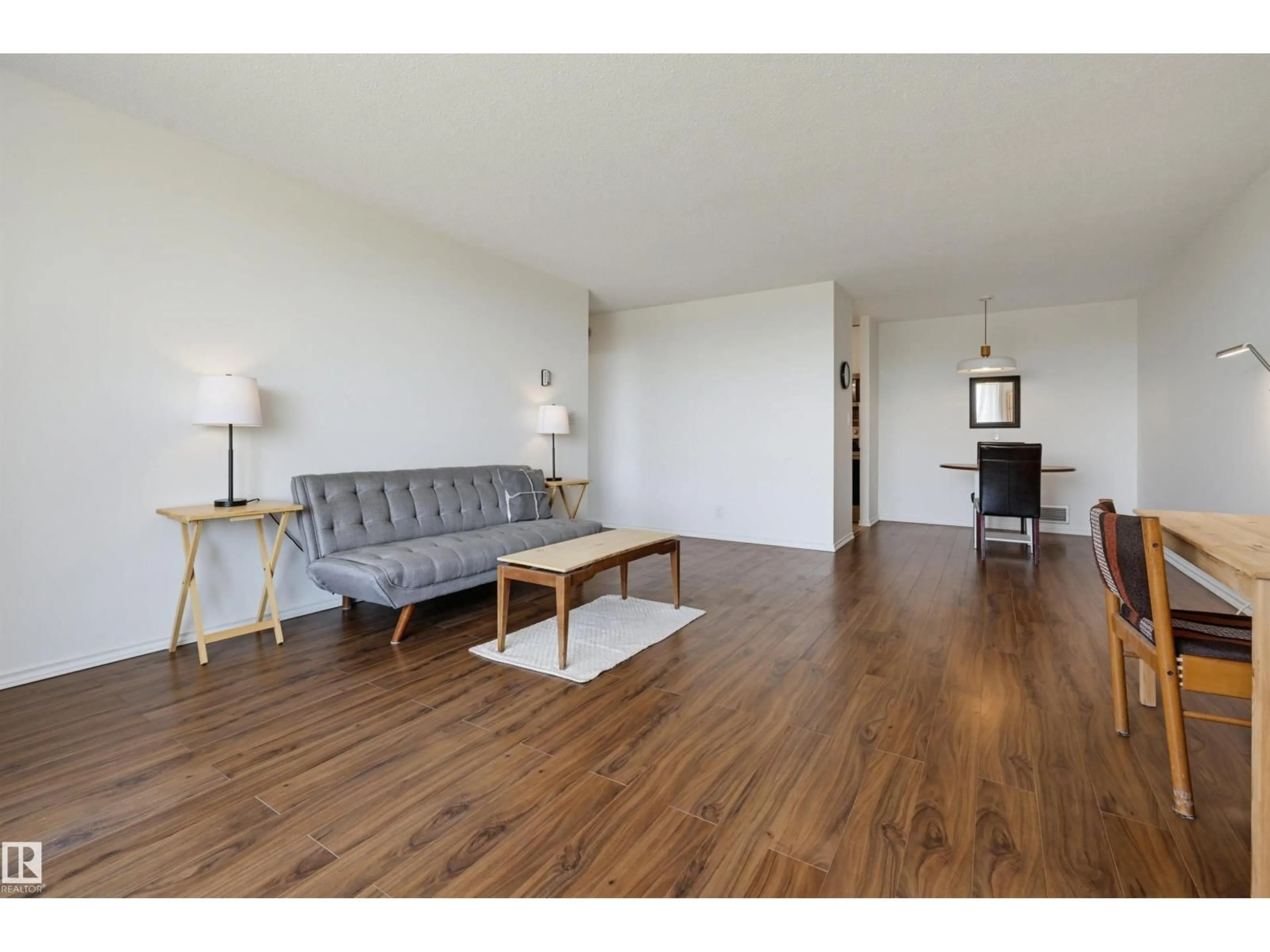 Living room with furniture, wood/laminate floor for 709 - 11307 99 AV, Edmonton Alberta T5K0H2