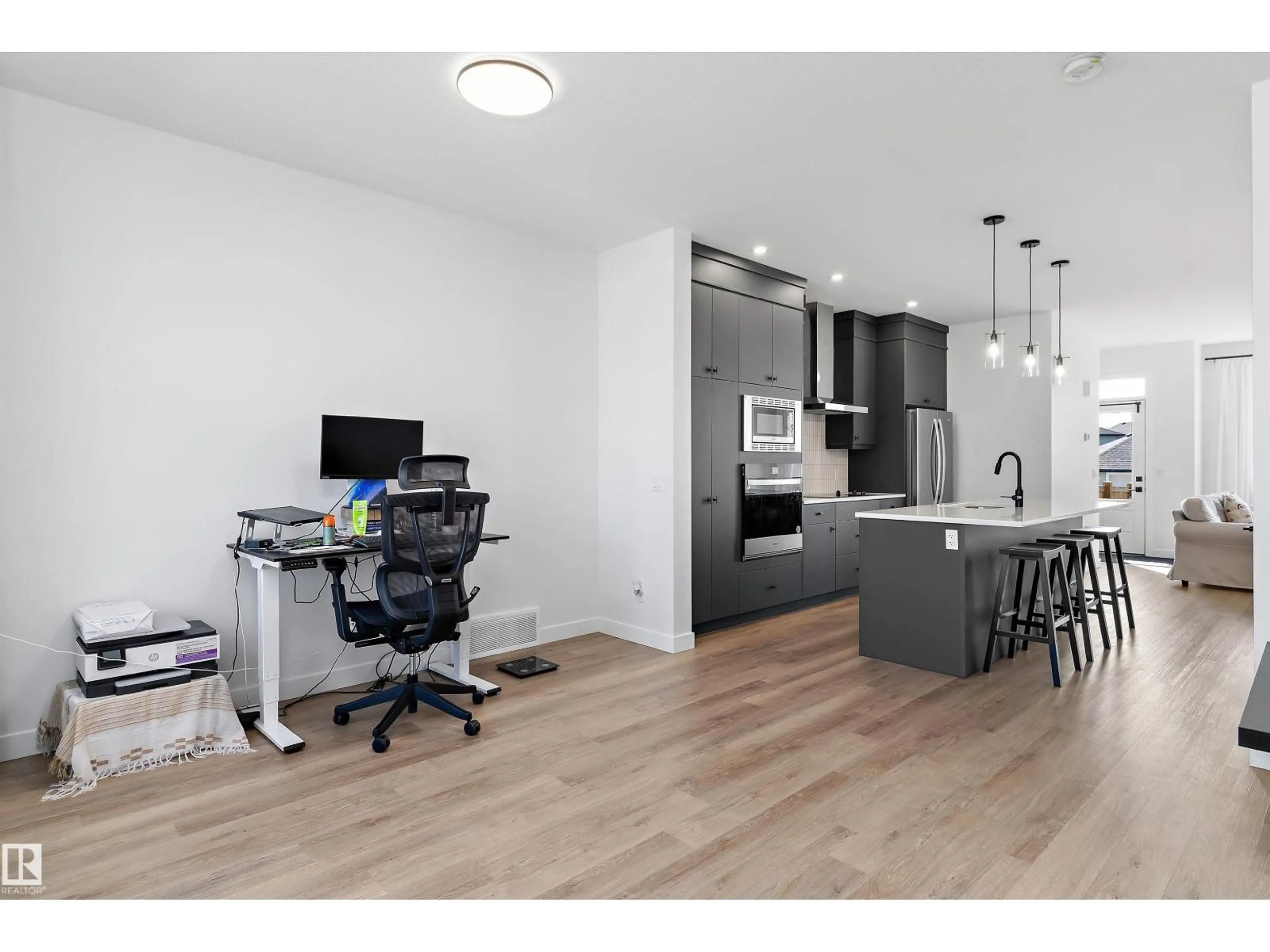 Open concept kitchen, wood/laminate floor for 1439 GOODSPEED LN, Edmonton Alberta T5T0W2