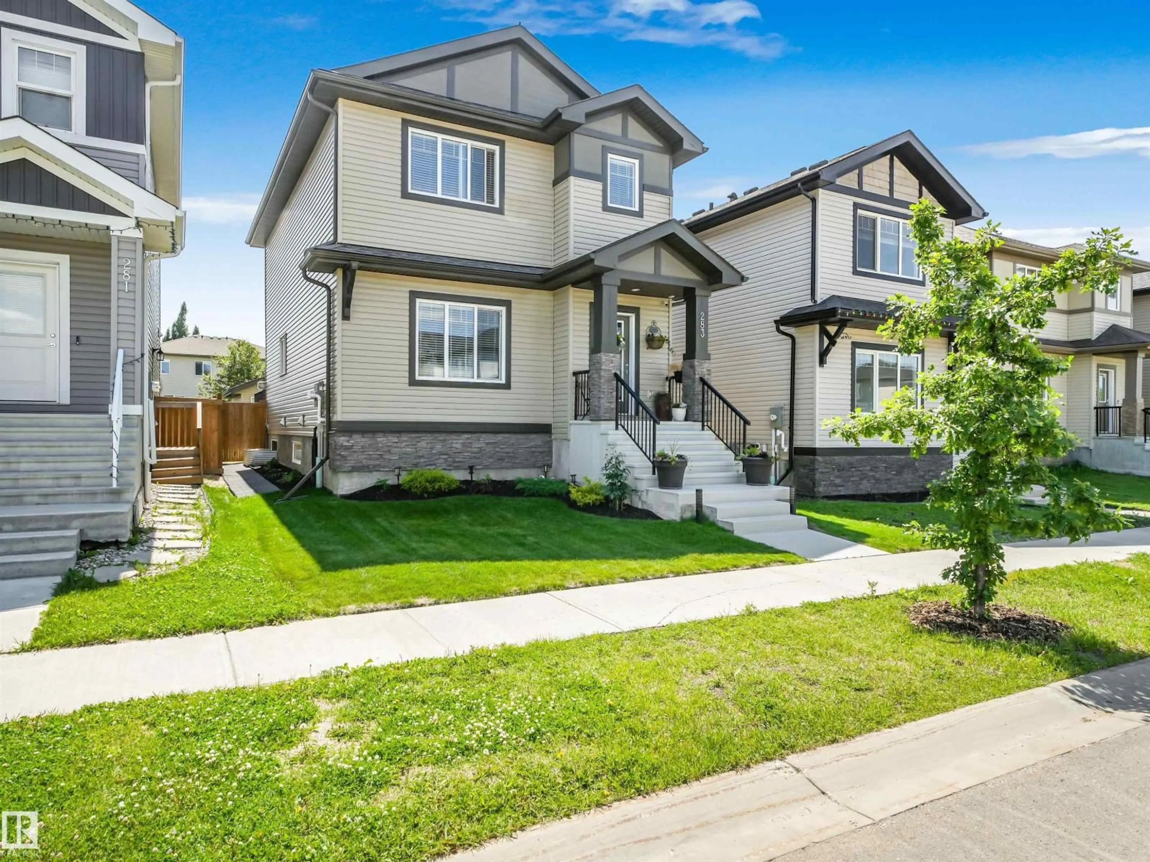 Home with vinyl exterior material, street for 283 AMEENA DR, Leduc Alberta T9E1J1