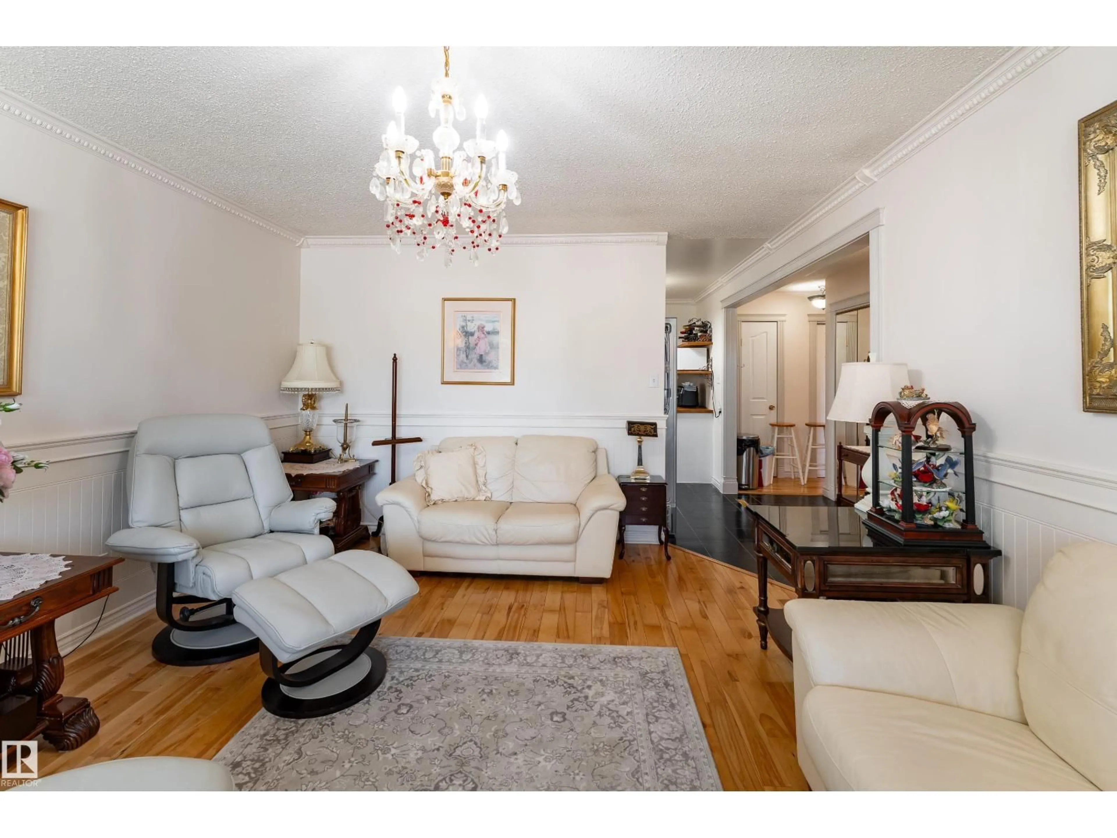 Living room with furniture, wood/laminate floor for NW - 4312 70 ST, Edmonton Alberta T6K0V1