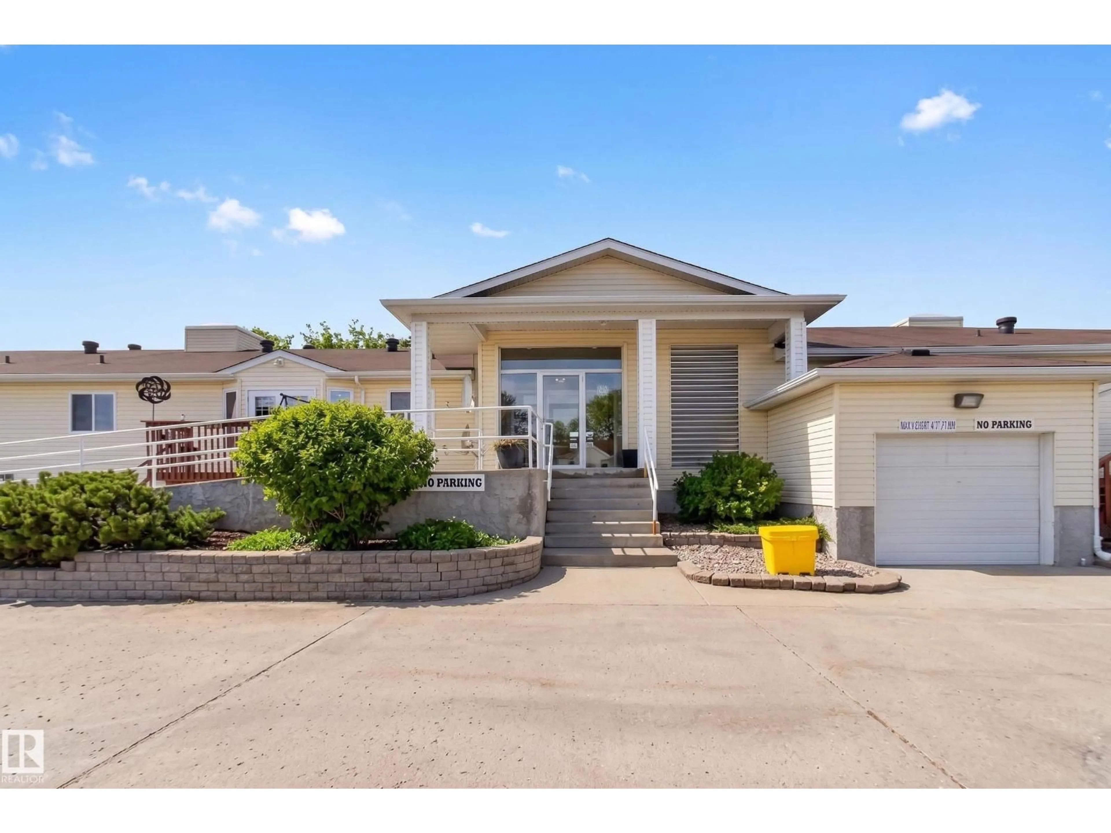 Home with vinyl exterior material, street for 202 - 10502 101 AV, Morinville Alberta T8R1V7
