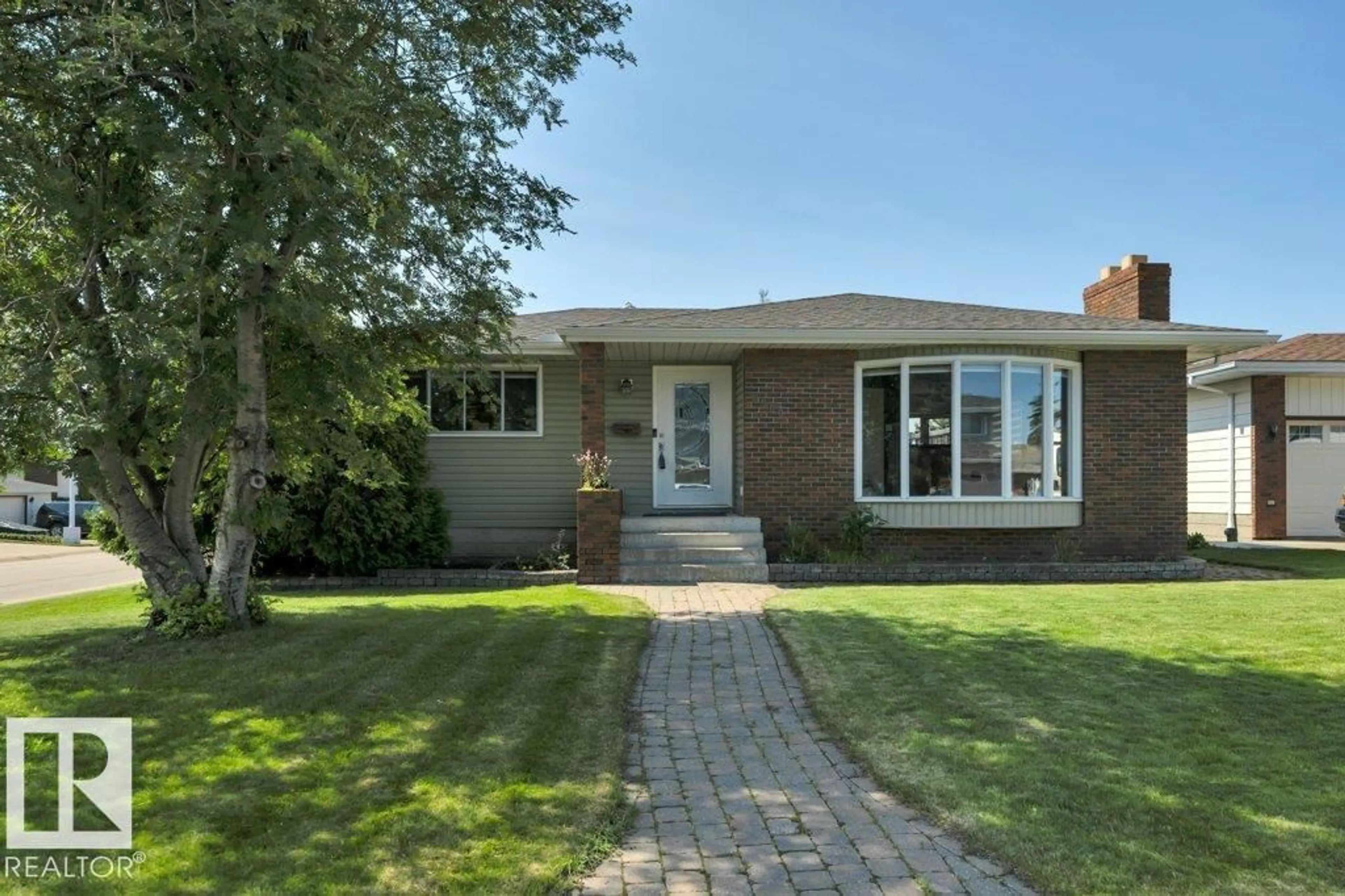 Home with brick exterior material, street for 6960 21 AV, Edmonton Alberta T6K2H4