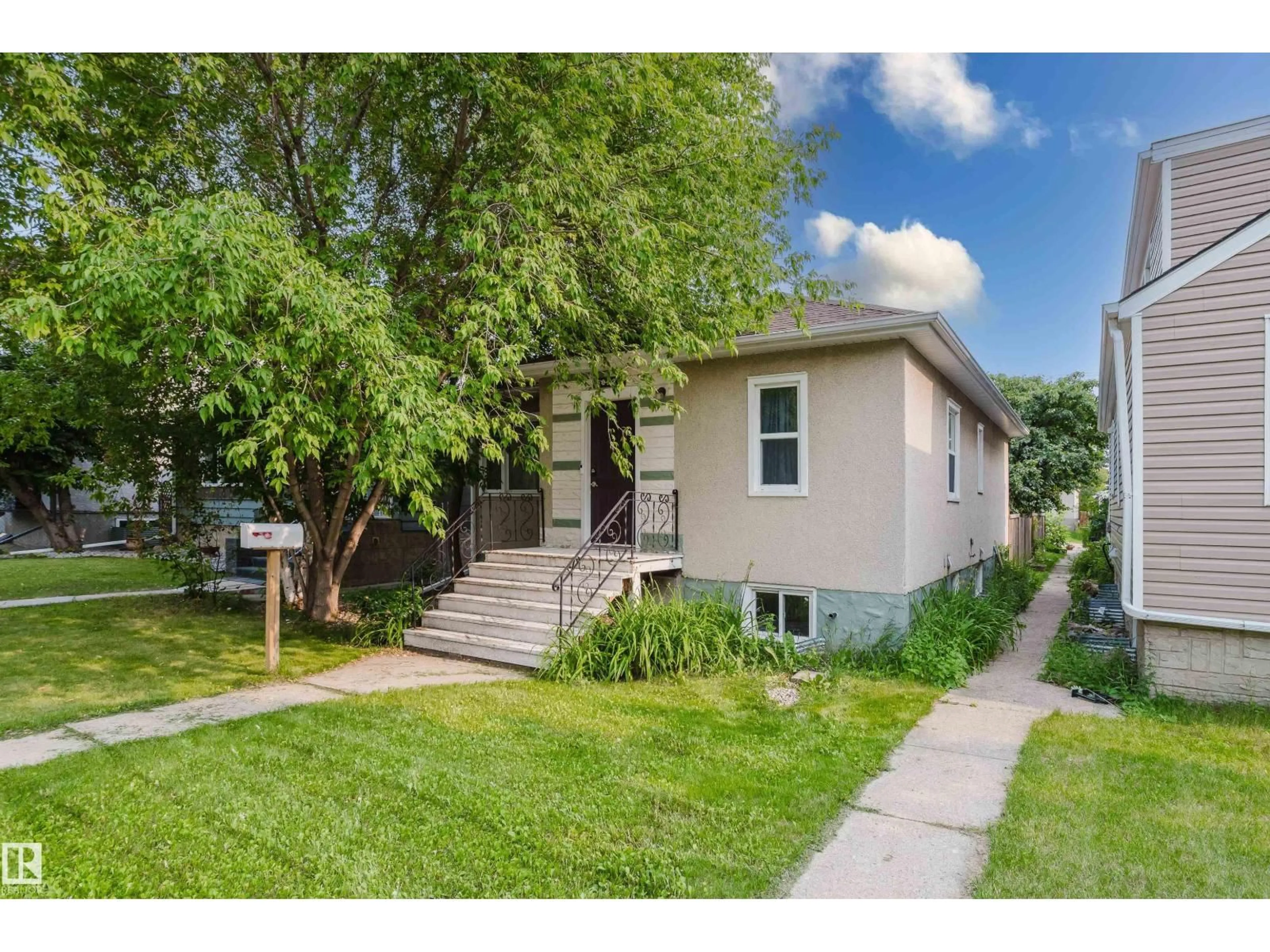 Home with vinyl exterior material, street for 10623 76 AV, Edmonton Alberta T6E1L6