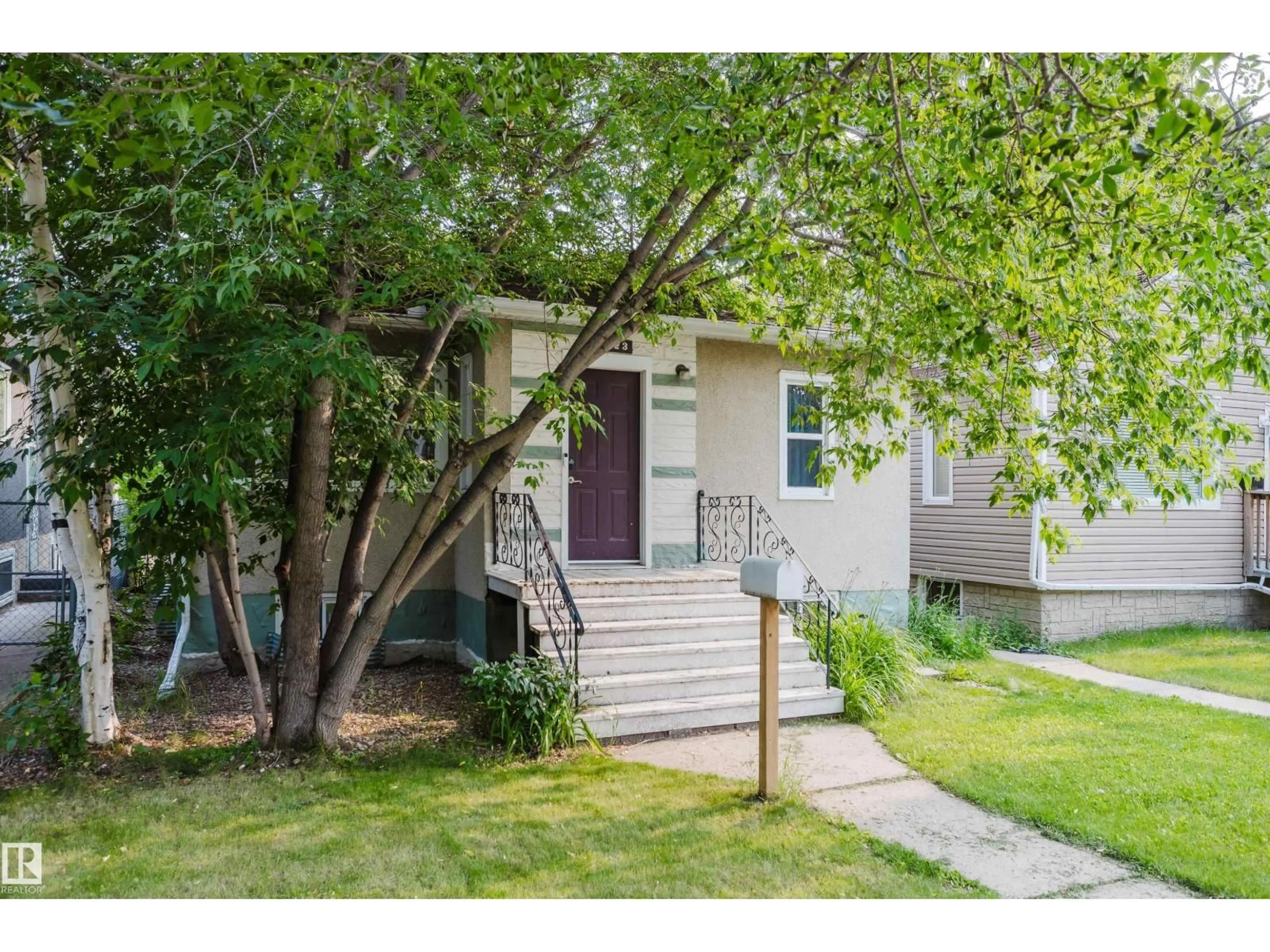 Home with vinyl exterior material, street for 10623 76 AV, Edmonton Alberta T6E1L6