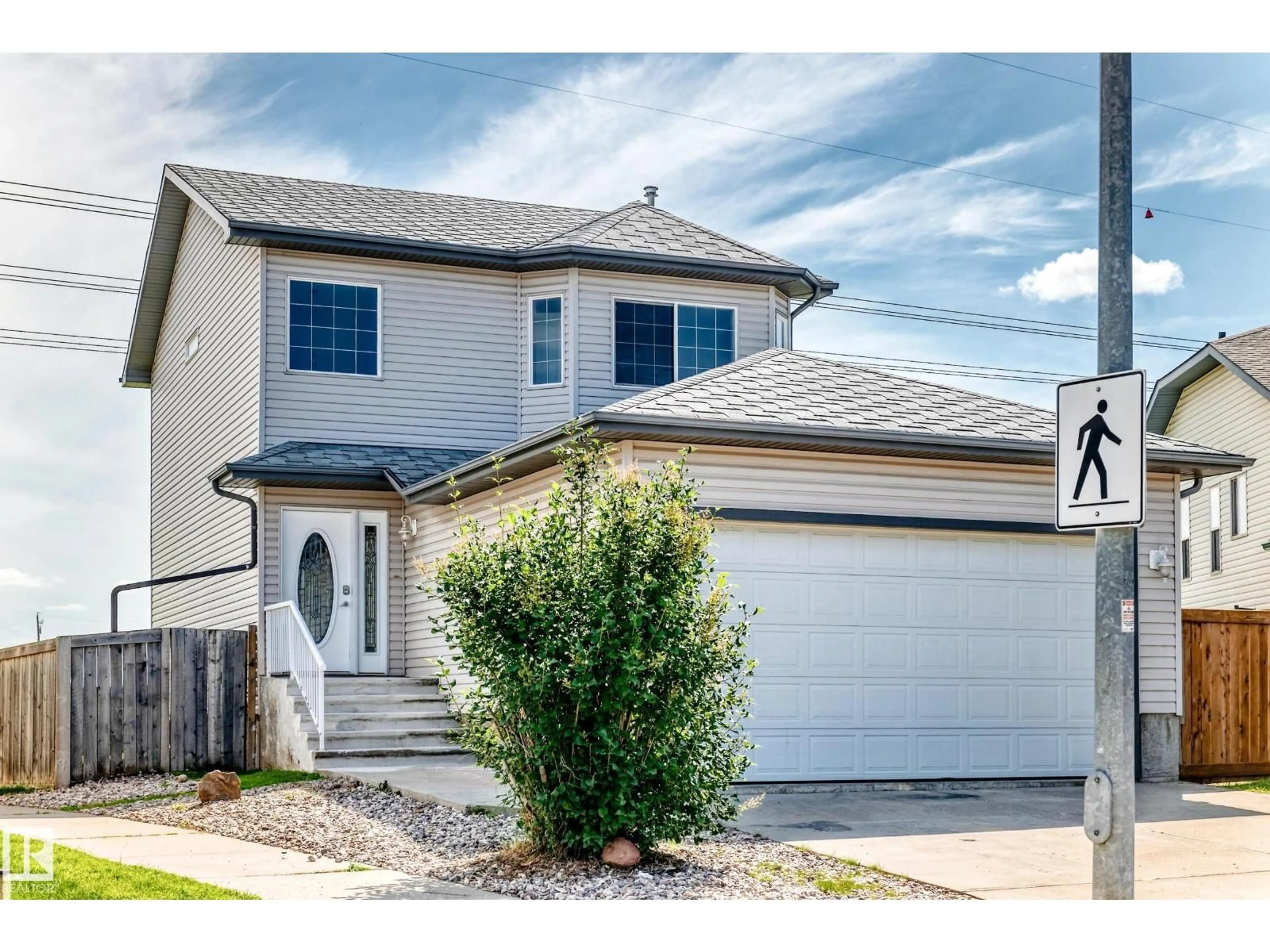 Home with vinyl exterior material, street for 686 KANANASKIS DR, Devon Alberta T9G2G8