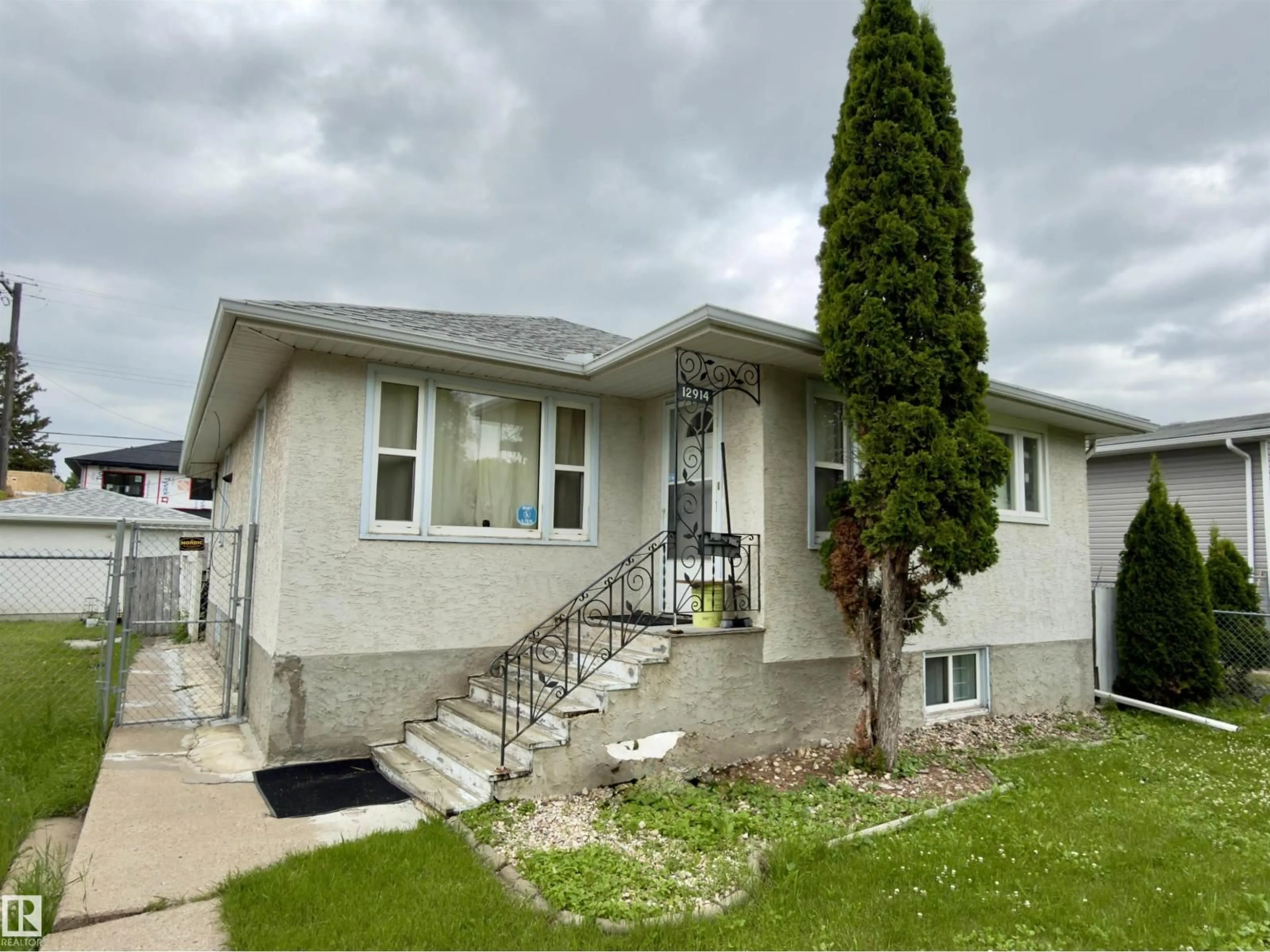 Home with vinyl exterior material, street for 12914 68 ST, Edmonton Alberta T5C0E8
