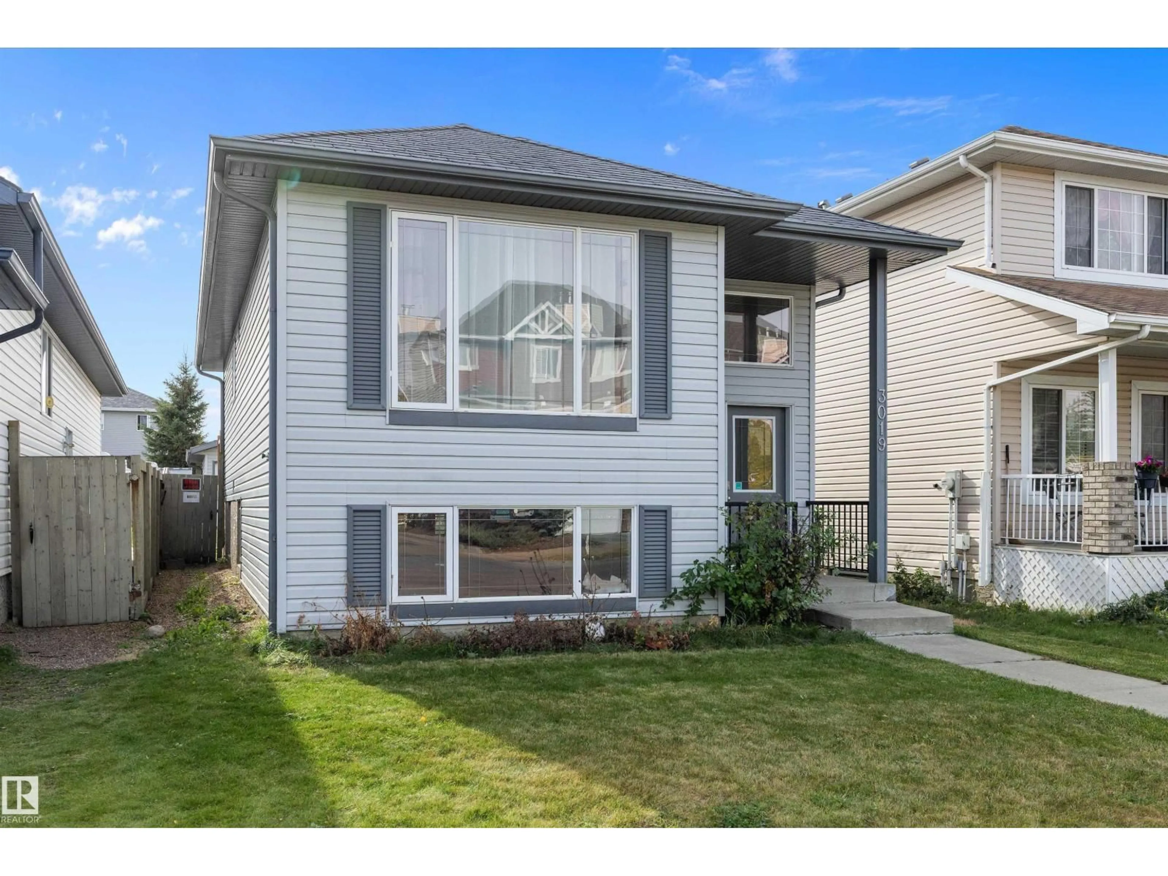 Home with vinyl exterior material, street for 3019 33 AV, Edmonton Alberta T6T1X2