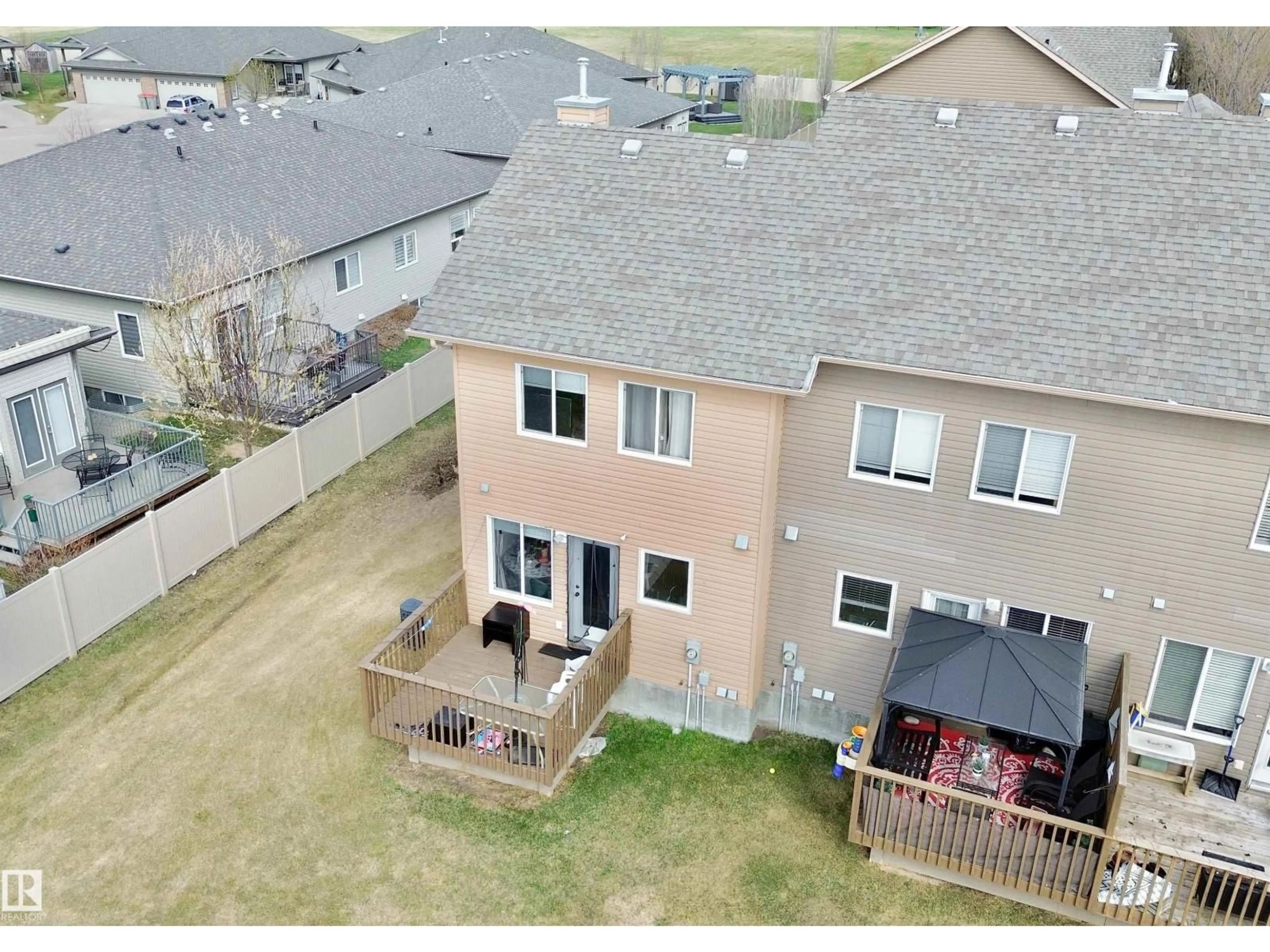 A pic from outside/outdoor area/front of a property/back of a property/a pic from drone, unknown for #4 - 320 SPRUCE RIDGE RD, Spruce Grove Alberta T7X0H5