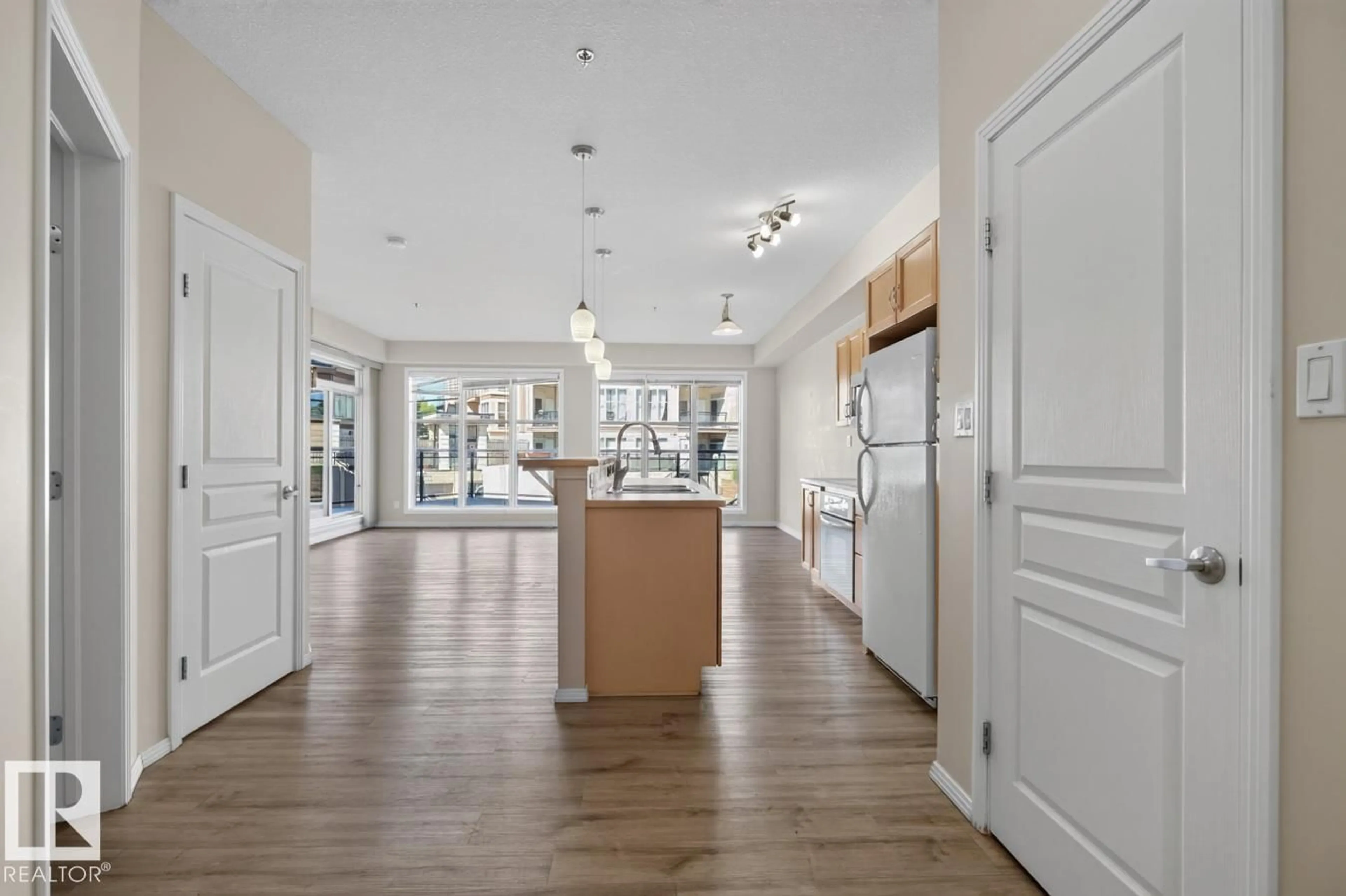 Open concept kitchen, unknown for #100 - 4835 104A ST, Edmonton Alberta T6H0R5