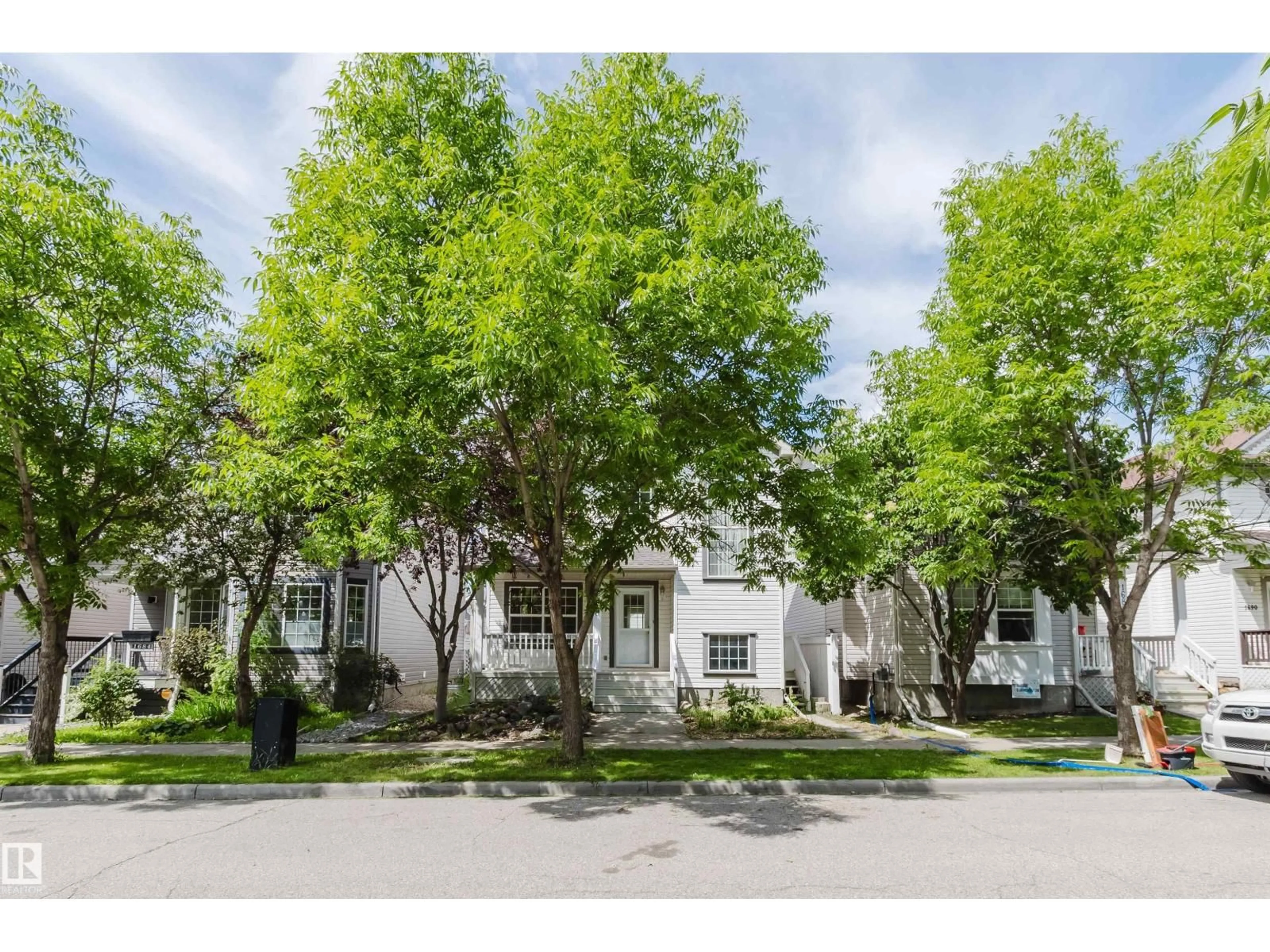 A pic from outside/outdoor area/front of a property/back of a property/a pic from drone, street for 1686 TOMPKINS WD, Edmonton Alberta T6R2Y4