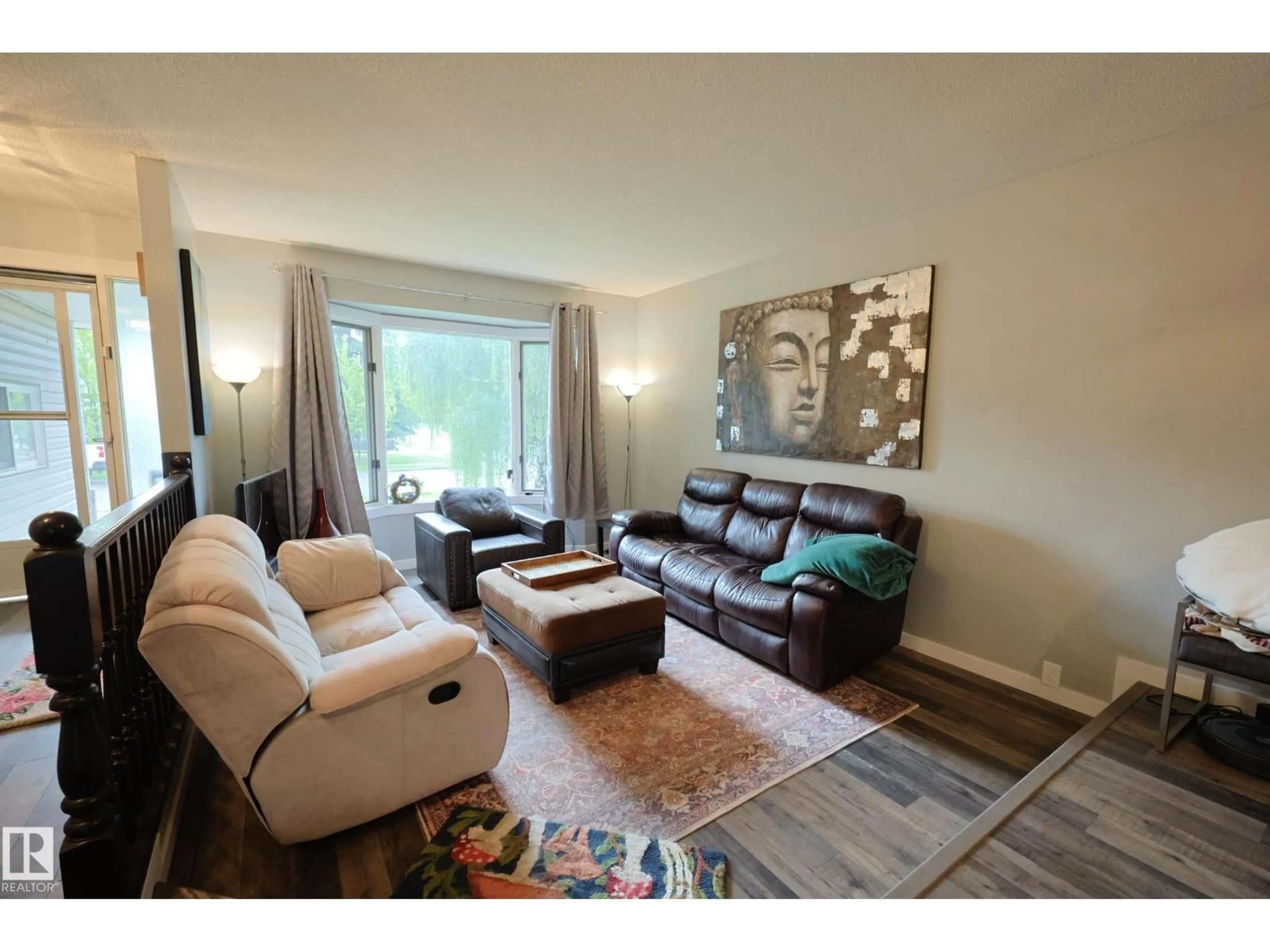 Living room with furniture, wood/laminate floor for 11 LAVOIE PL, St. Albert Alberta T8N4M6