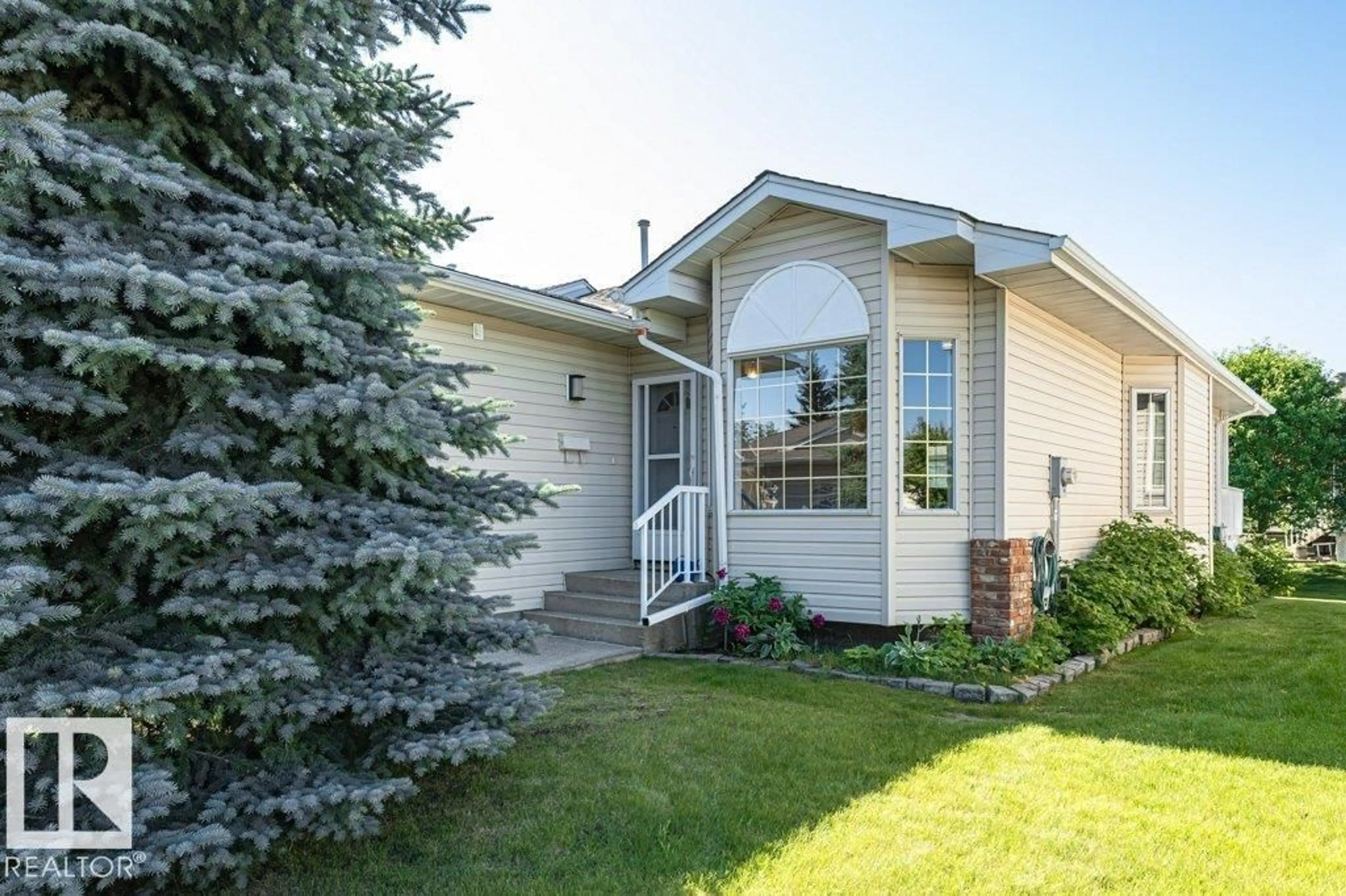 Home with vinyl exterior material, street for 957 YOUVILLE DR, Edmonton Alberta T6L6T2