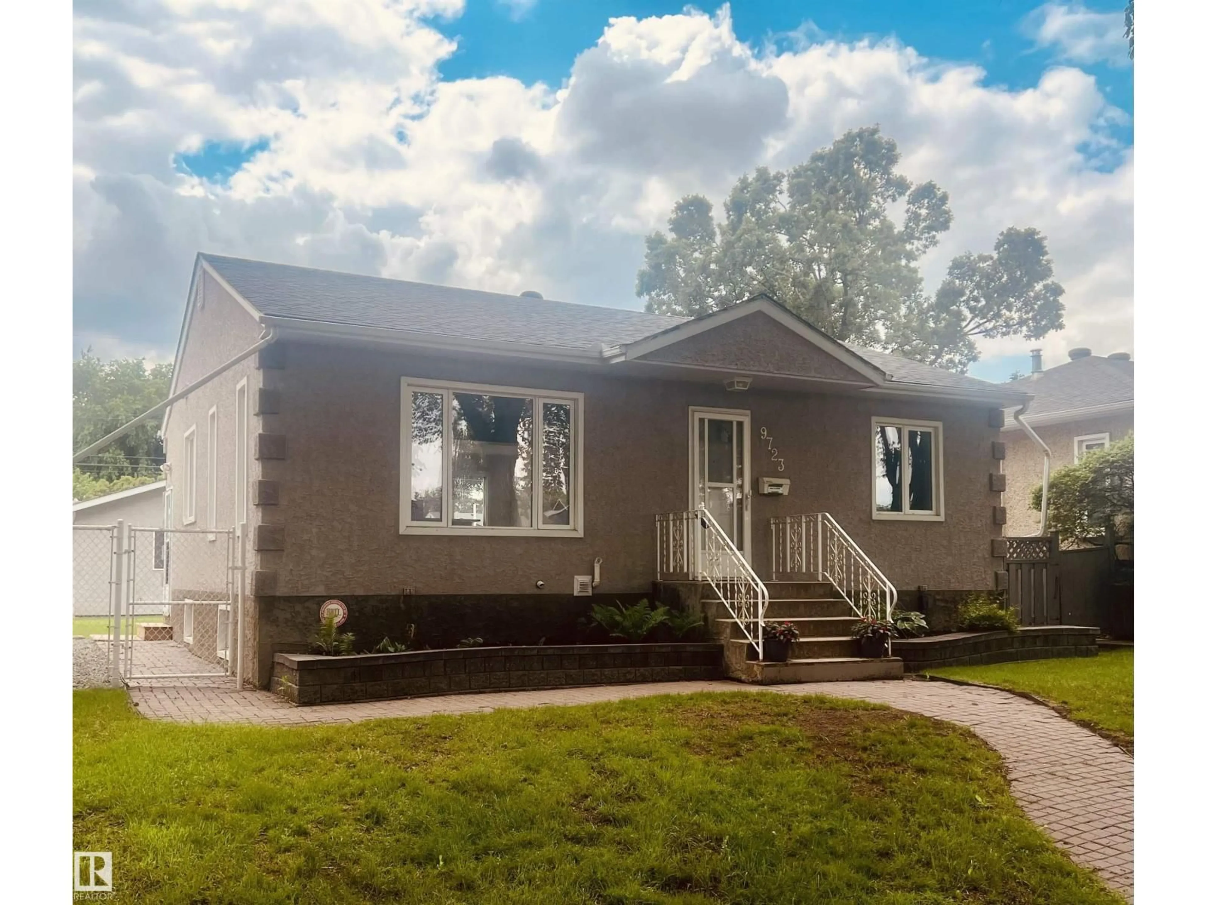 Home with vinyl exterior material, street for NW - 9723 65 AV, Edmonton Alberta T6E0M4