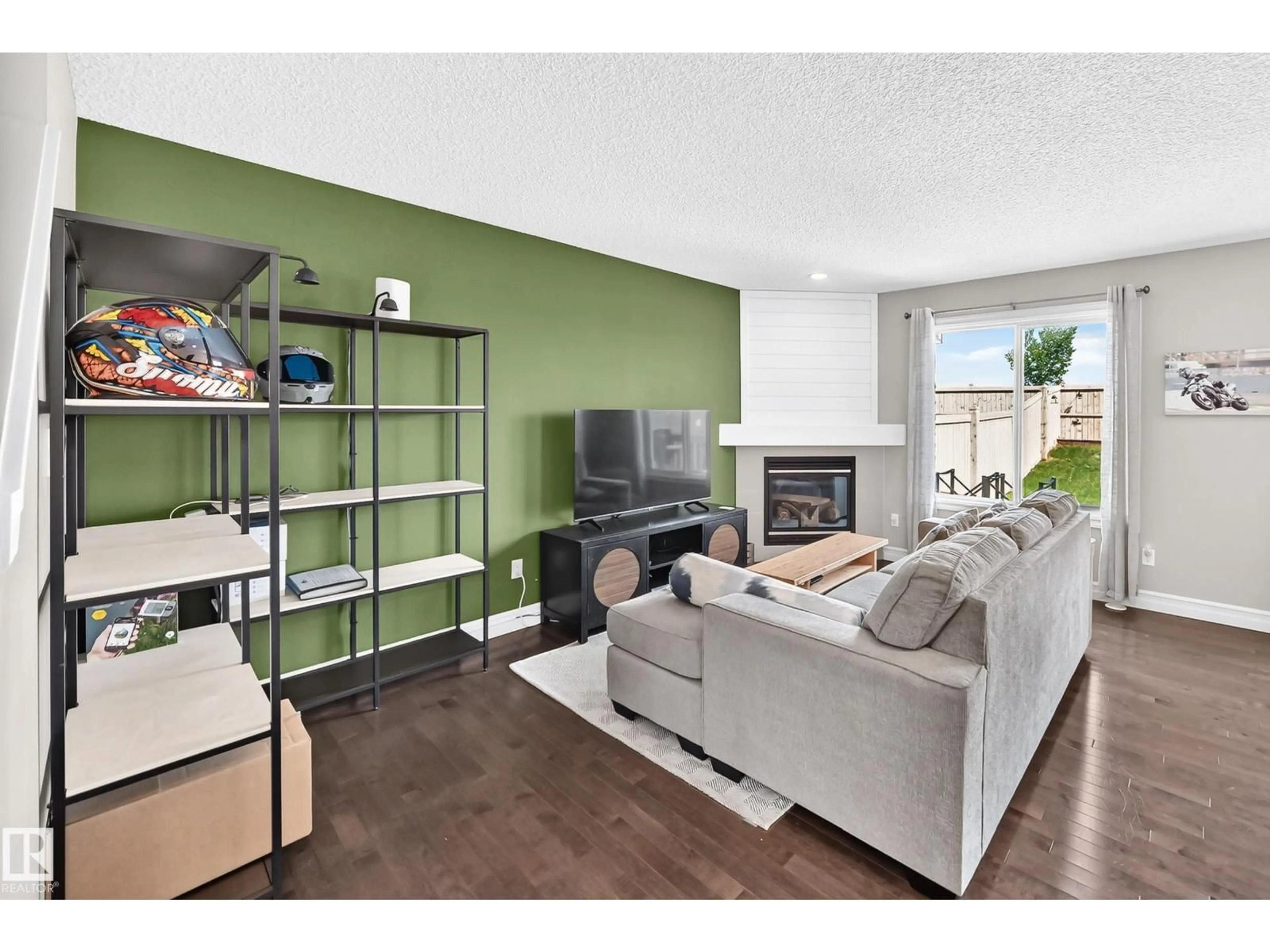 Living room with furniture, wood/laminate floor for 15908 10 AV, Edmonton Alberta T6W2H2