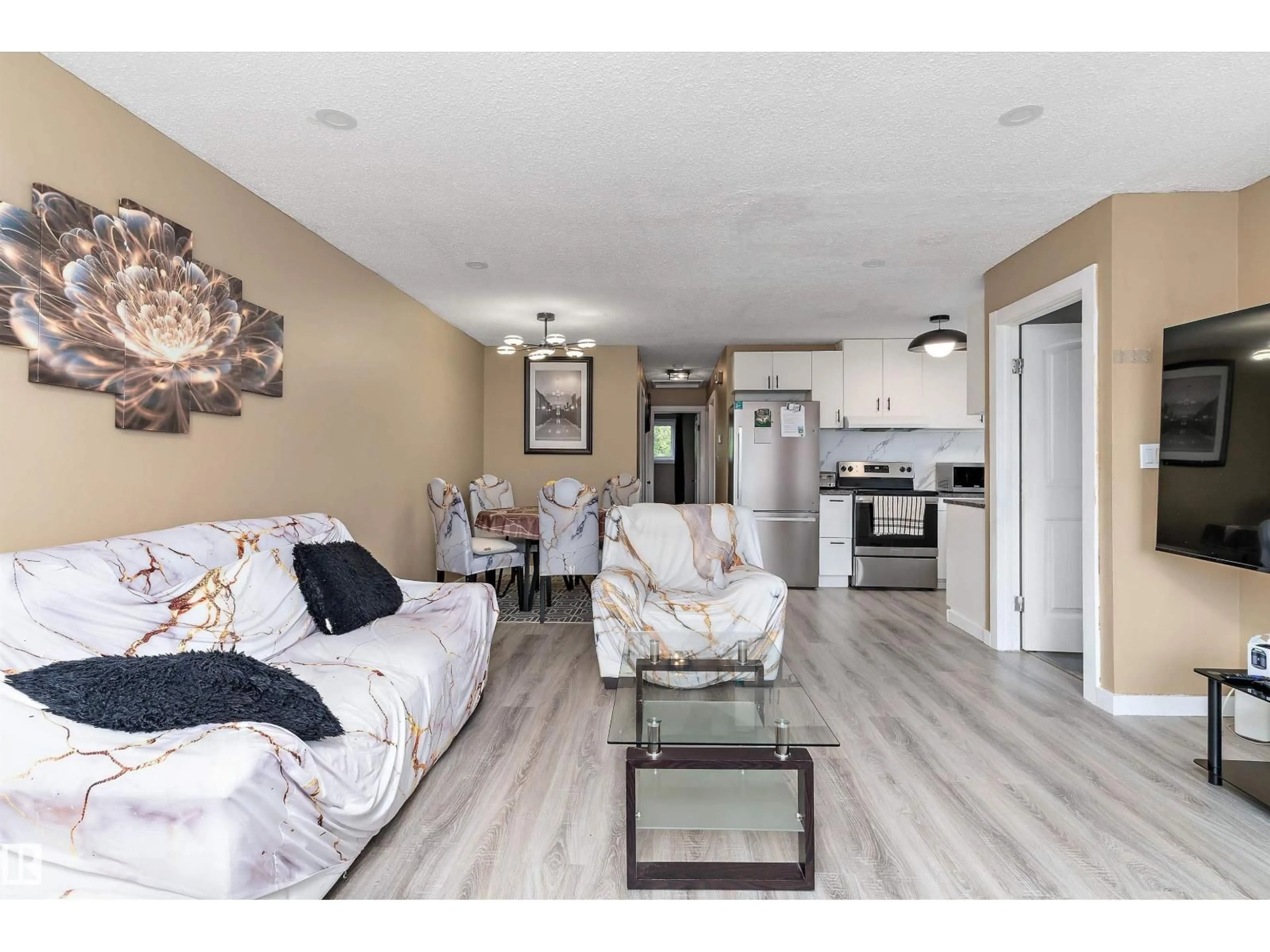 Living room with furniture, unknown for 3708 133 AV, Edmonton Alberta T5A3E9