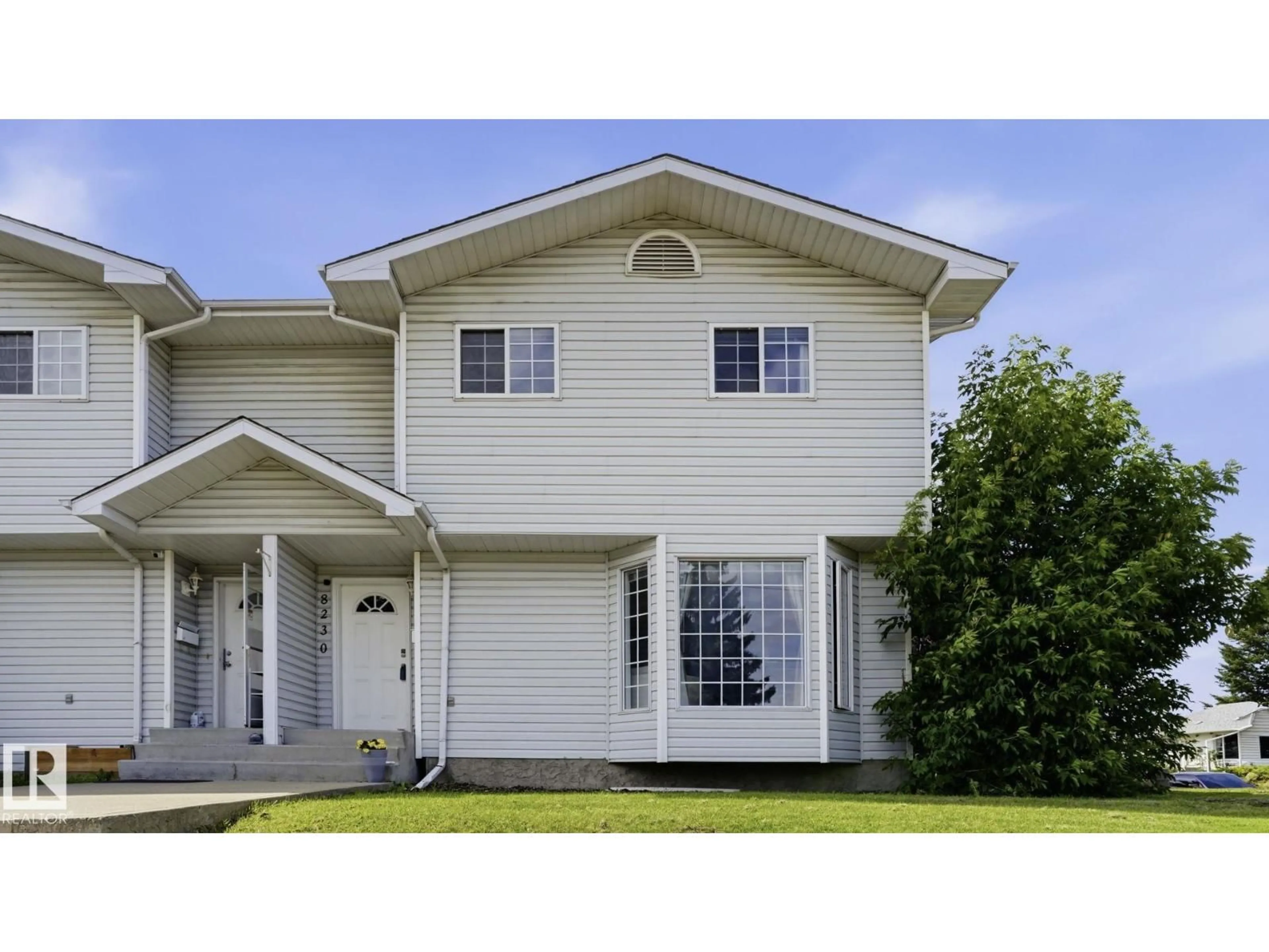 Home with vinyl exterior material, street for 8230 71 ST, Edmonton Alberta T6B1X2