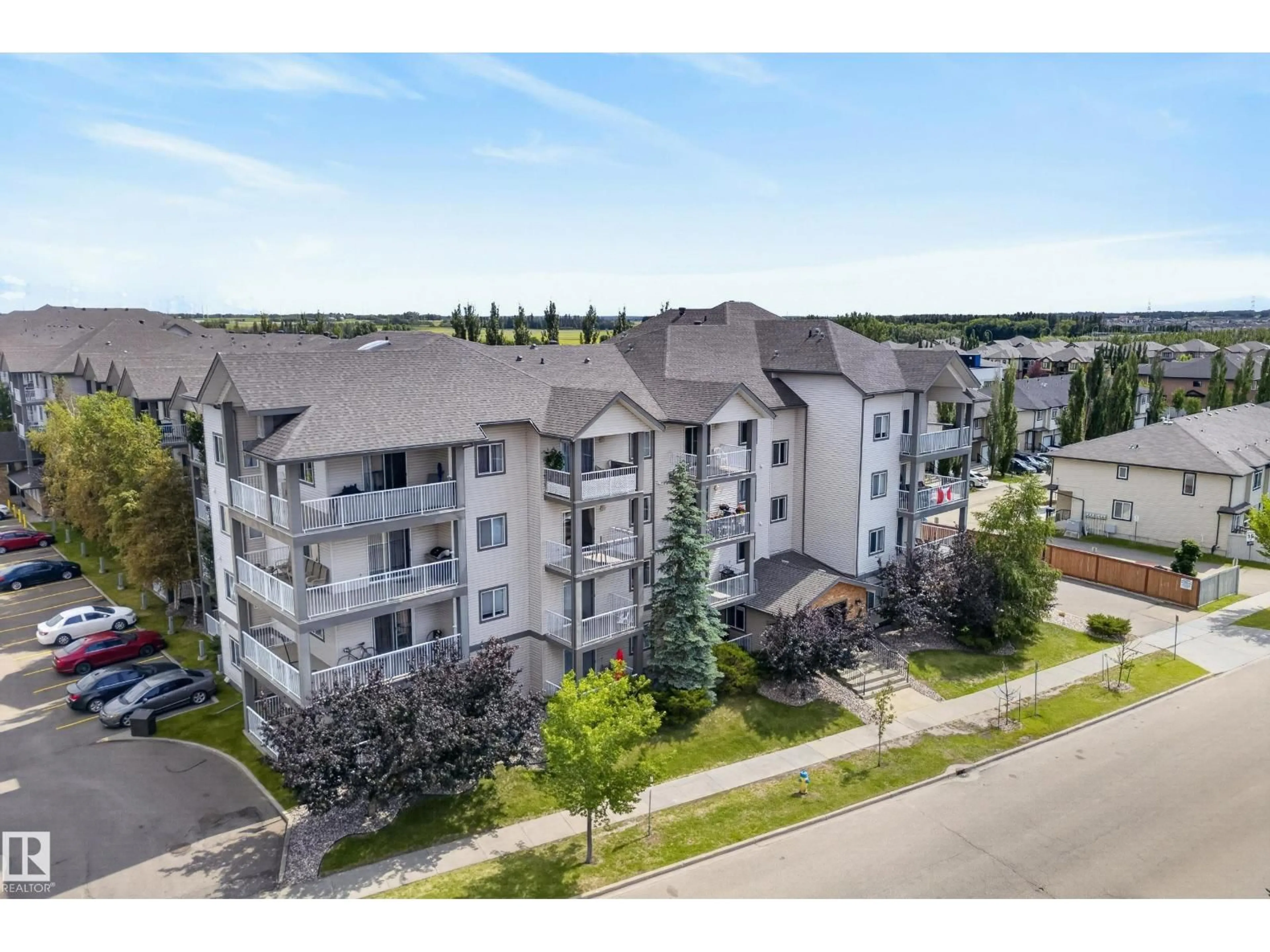 A pic from outside/outdoor area/front of a property/back of a property/a pic from drone, unknown for 430 - 3425 19 ST, Edmonton Alberta T6T2B5