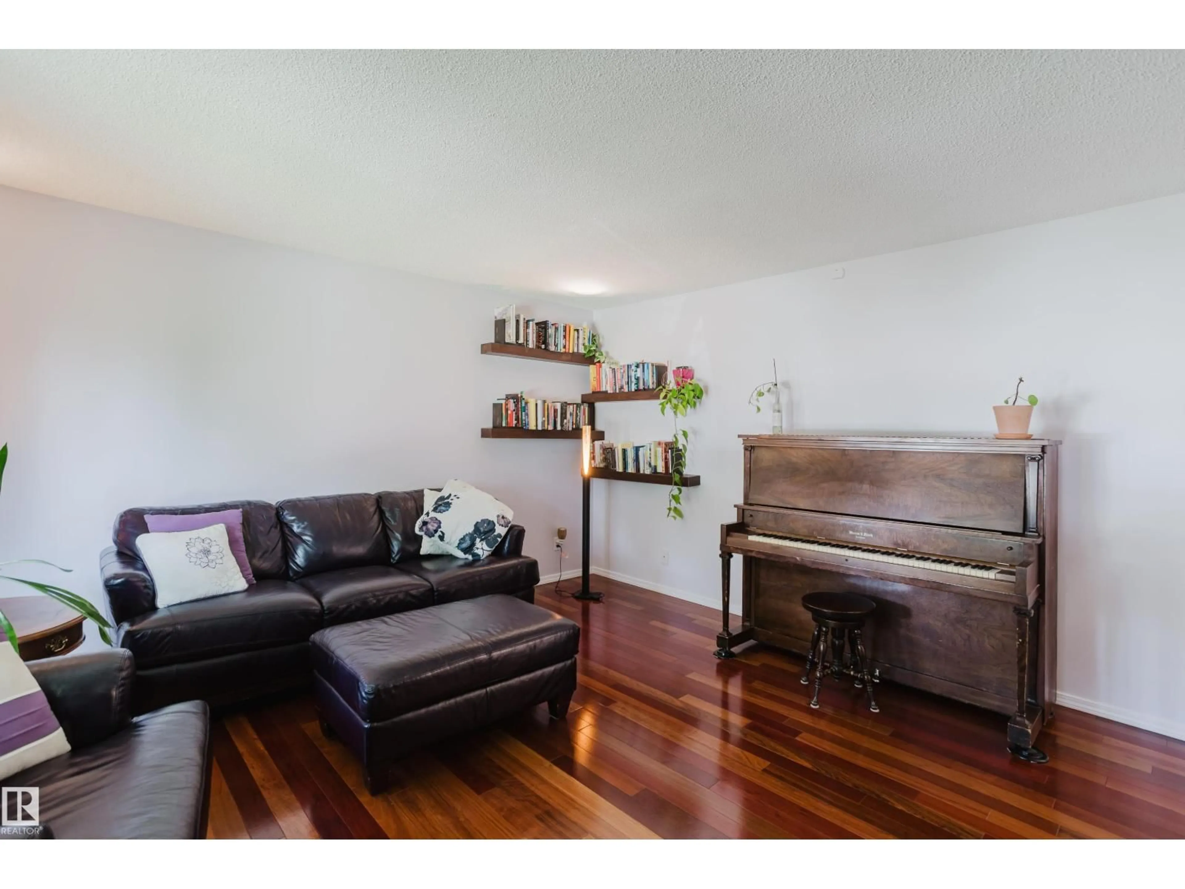 Living room with furniture, wood/laminate floor for 10433 32A AV, Edmonton Alberta T6J4A7