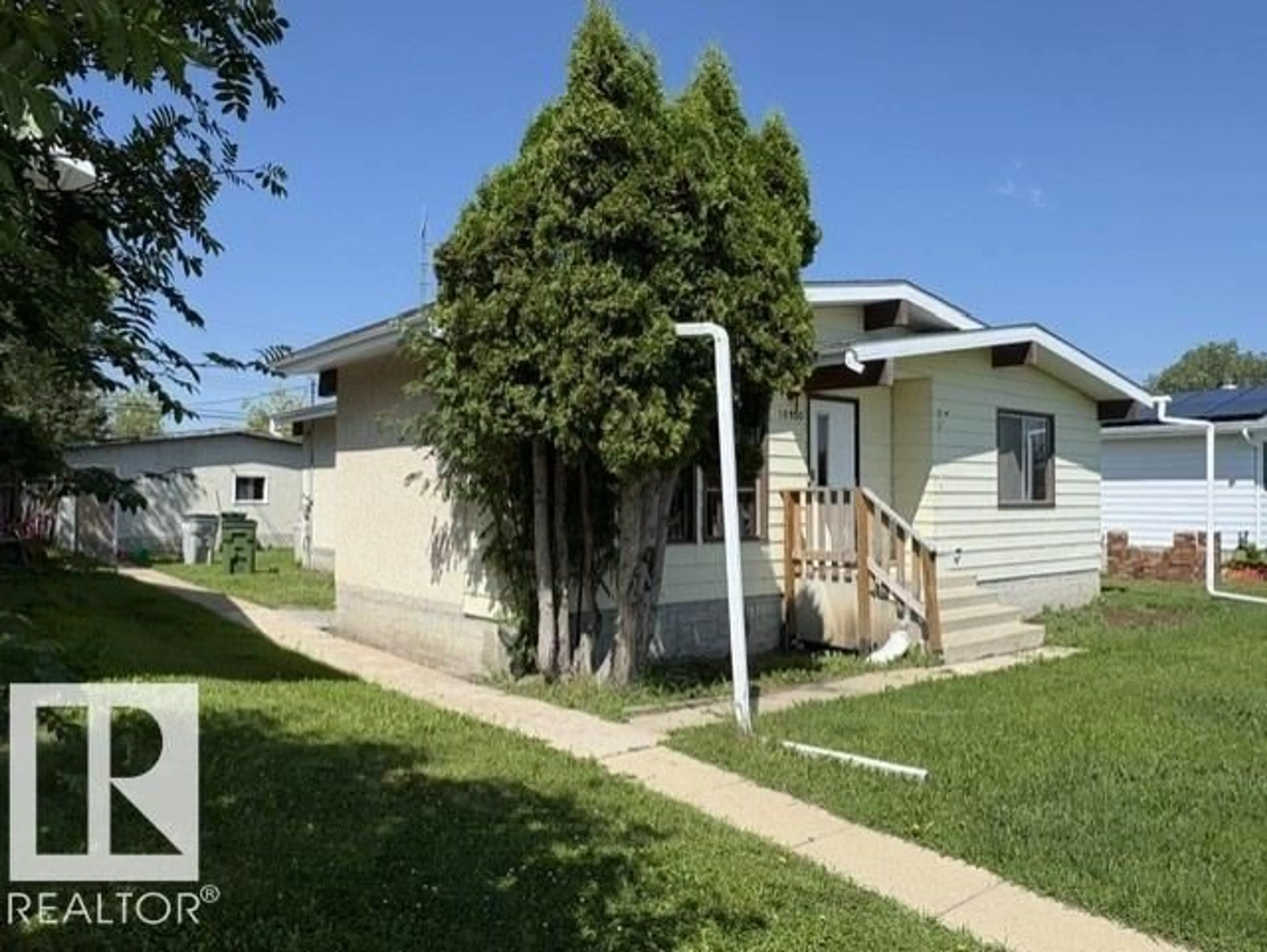 Home with vinyl exterior material, street for 10320 109 AV, Westlock Alberta T7P1B9