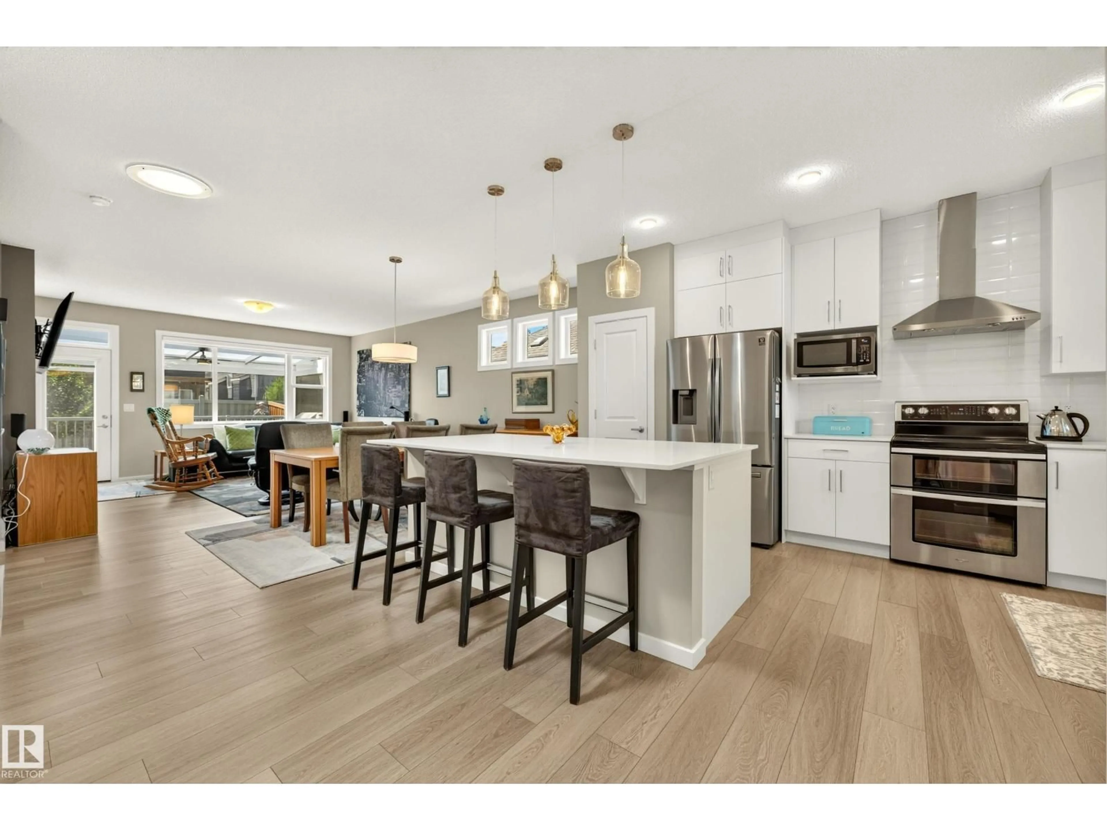 Open concept kitchen, wood/laminate floor for 8120 222 ST, Edmonton Alberta T5T7M9