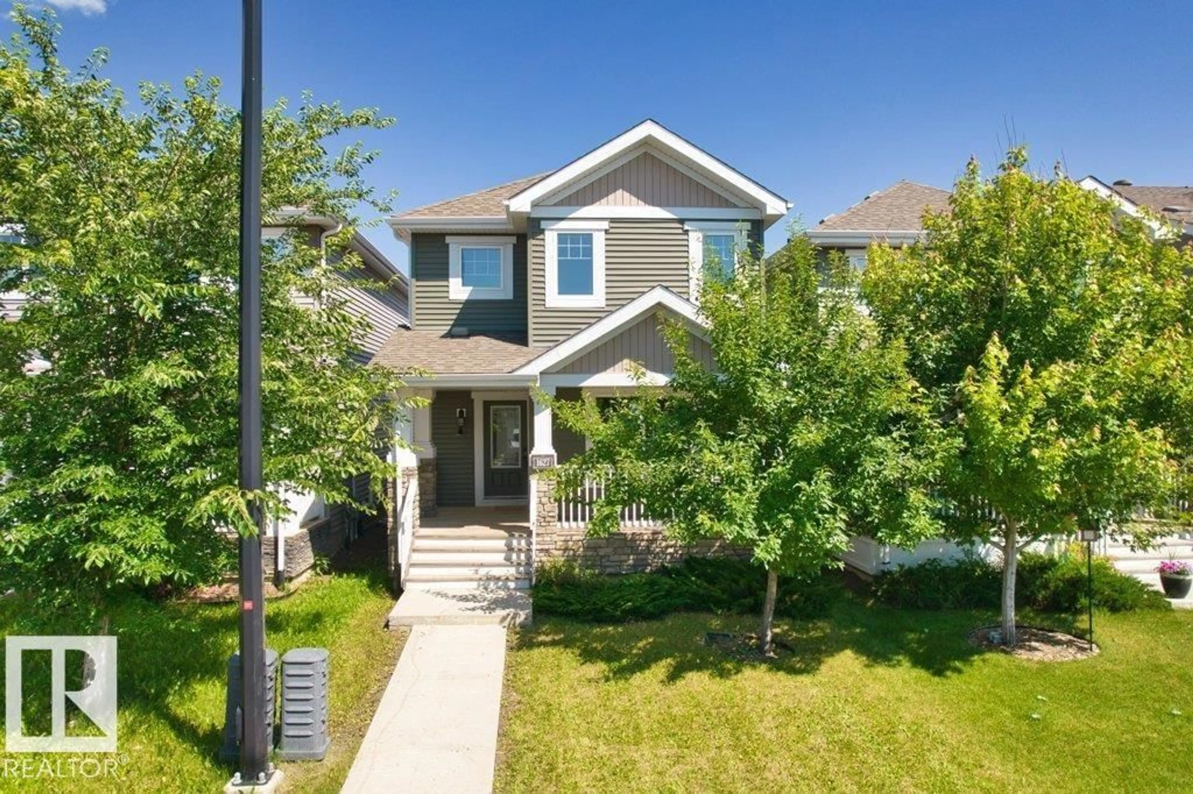 Home with vinyl exterior material, street for SW - 1627 167 ST, Edmonton Alberta T6W3C4