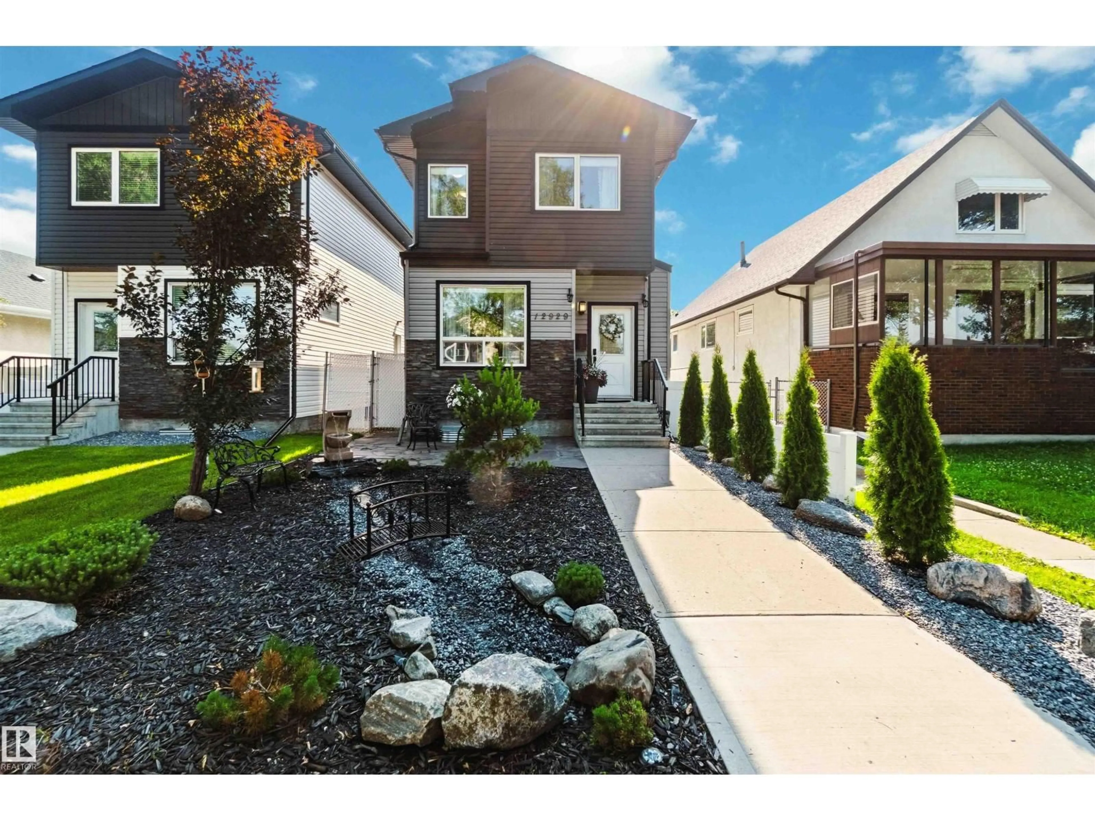 Home with vinyl exterior material, street for 12929 122 ST, Edmonton Alberta T5L0E8