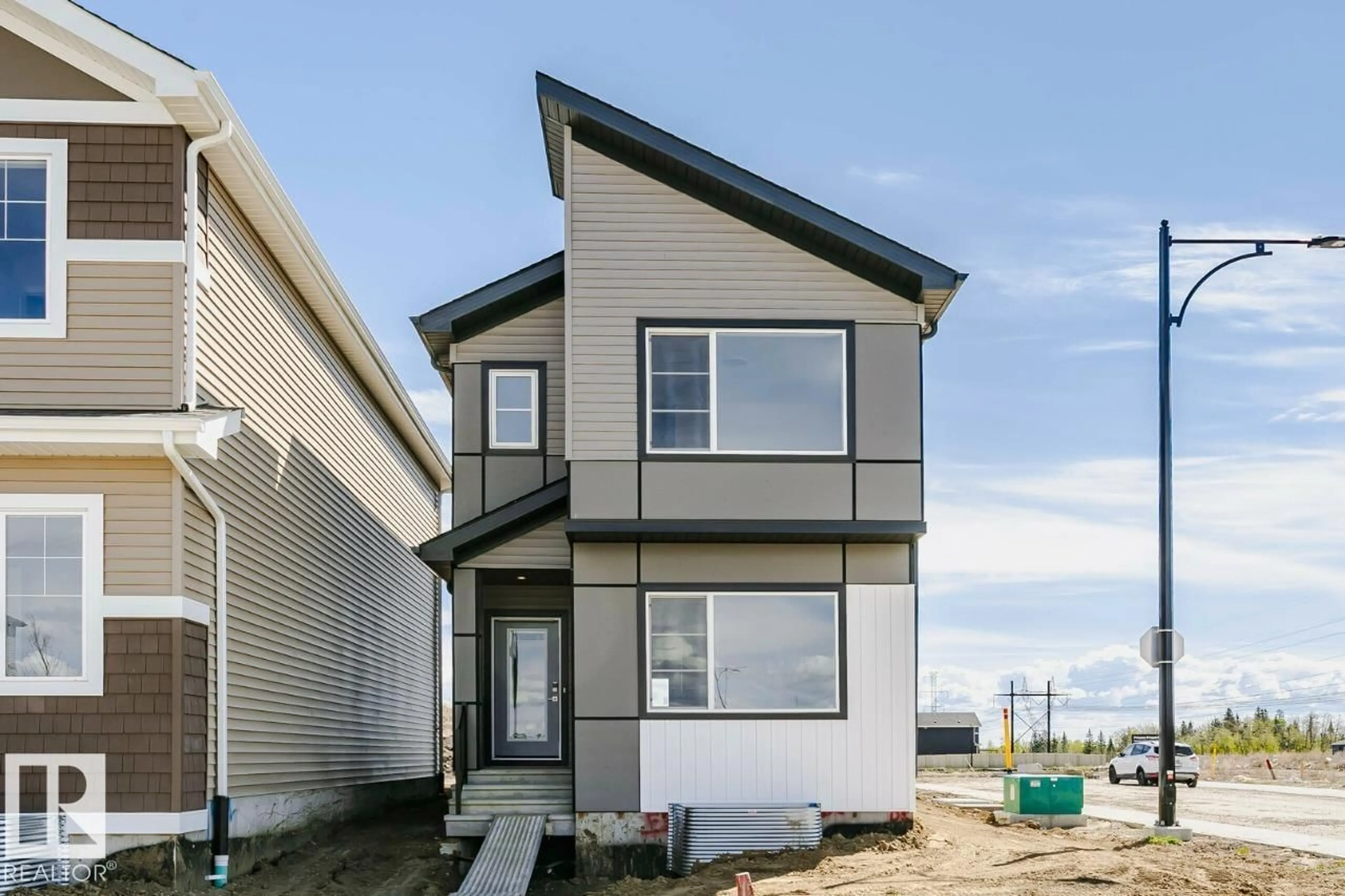 Home with vinyl exterior material, street for 303 EDGEMONT DR, Edmonton Alberta T6M3G7