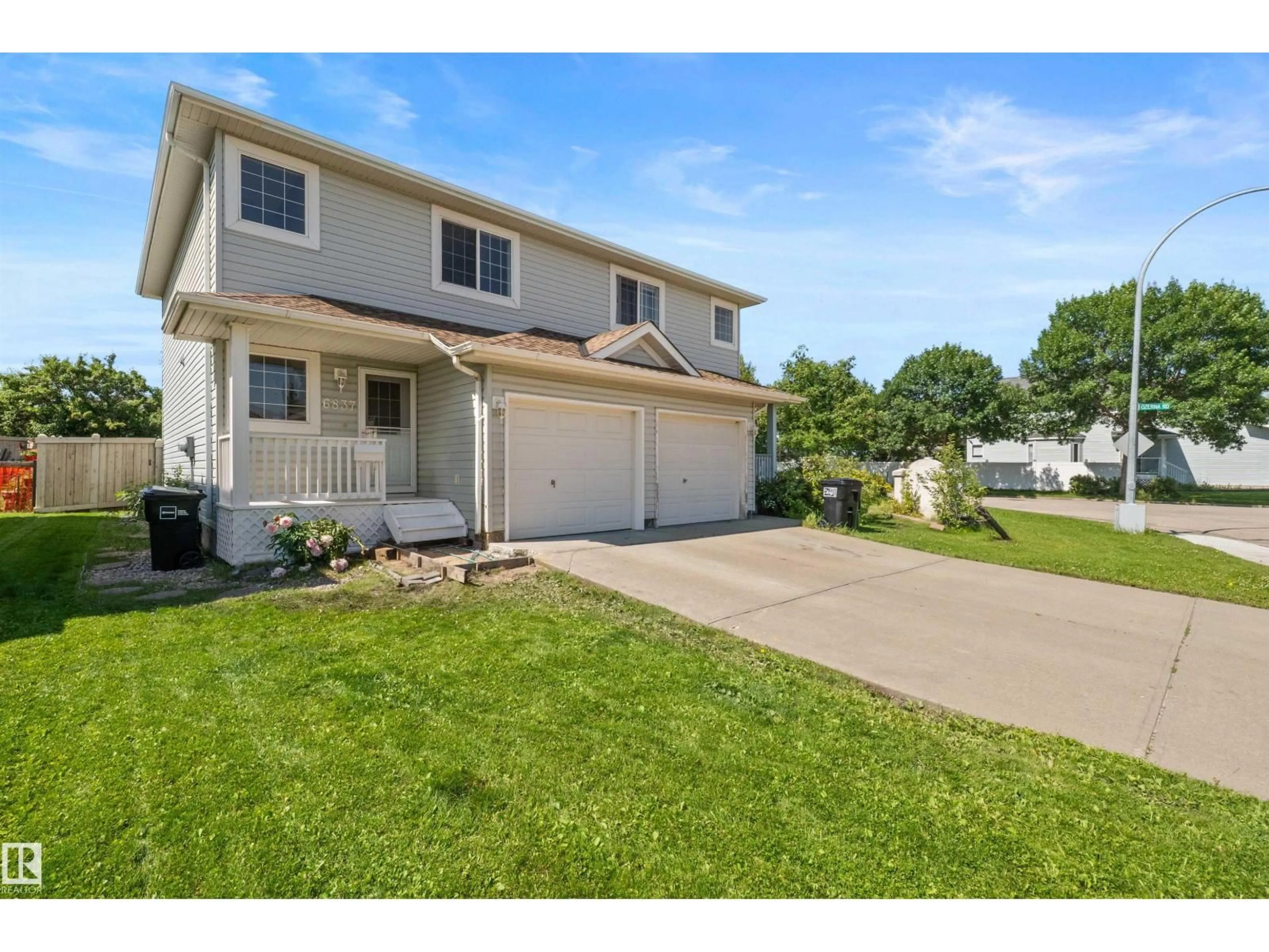 Home with vinyl exterior material, street for 6837 159A AV, Edmonton Alberta T5Z3N9