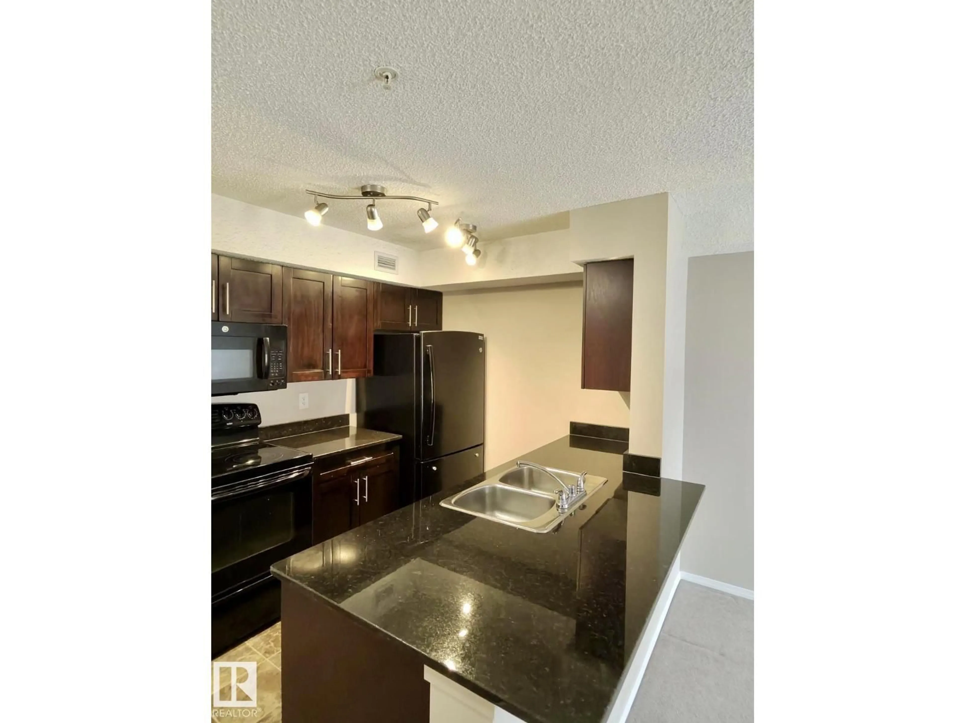 Open concept kitchen, unknown for #303 - 1060 MCCONACHIE BV, Edmonton Alberta T5J0W9