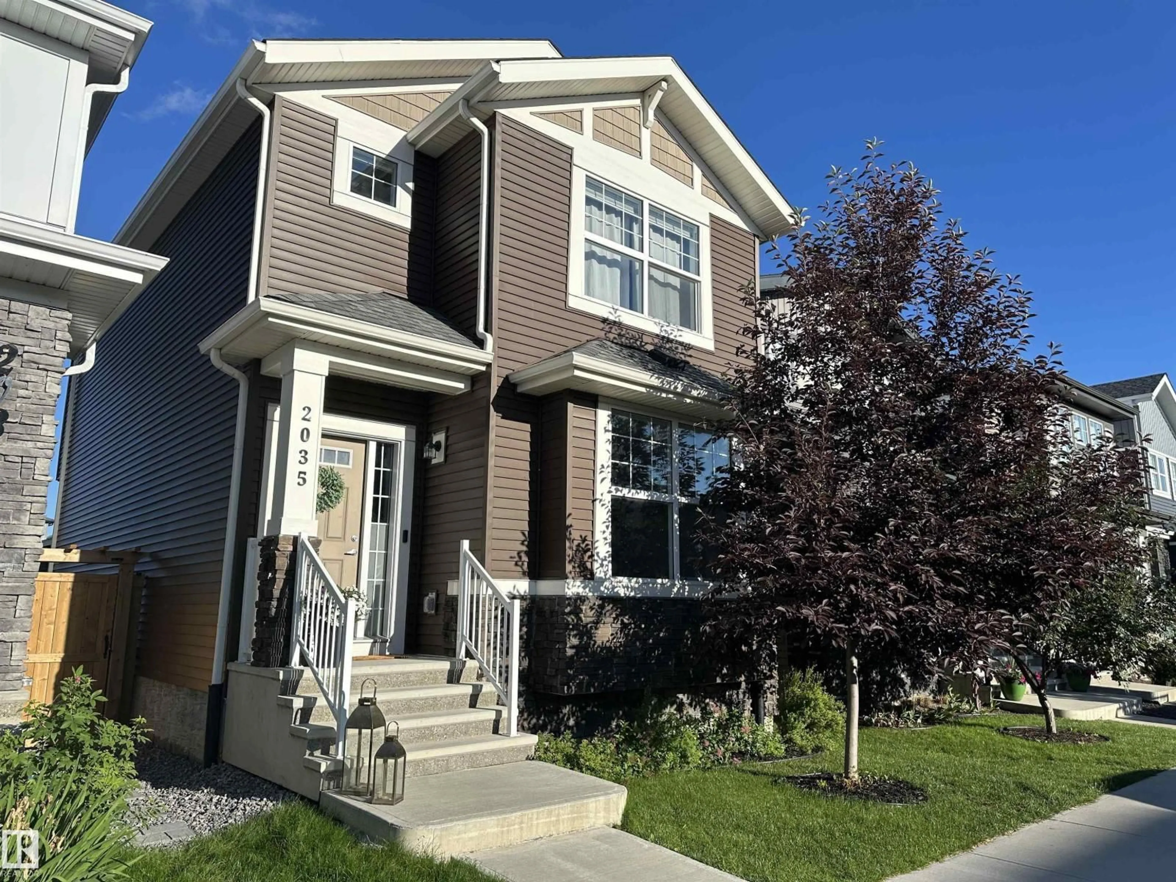 Home with vinyl exterior material, street for SW - 2035 160 ST, Edmonton Alberta T6W4E7