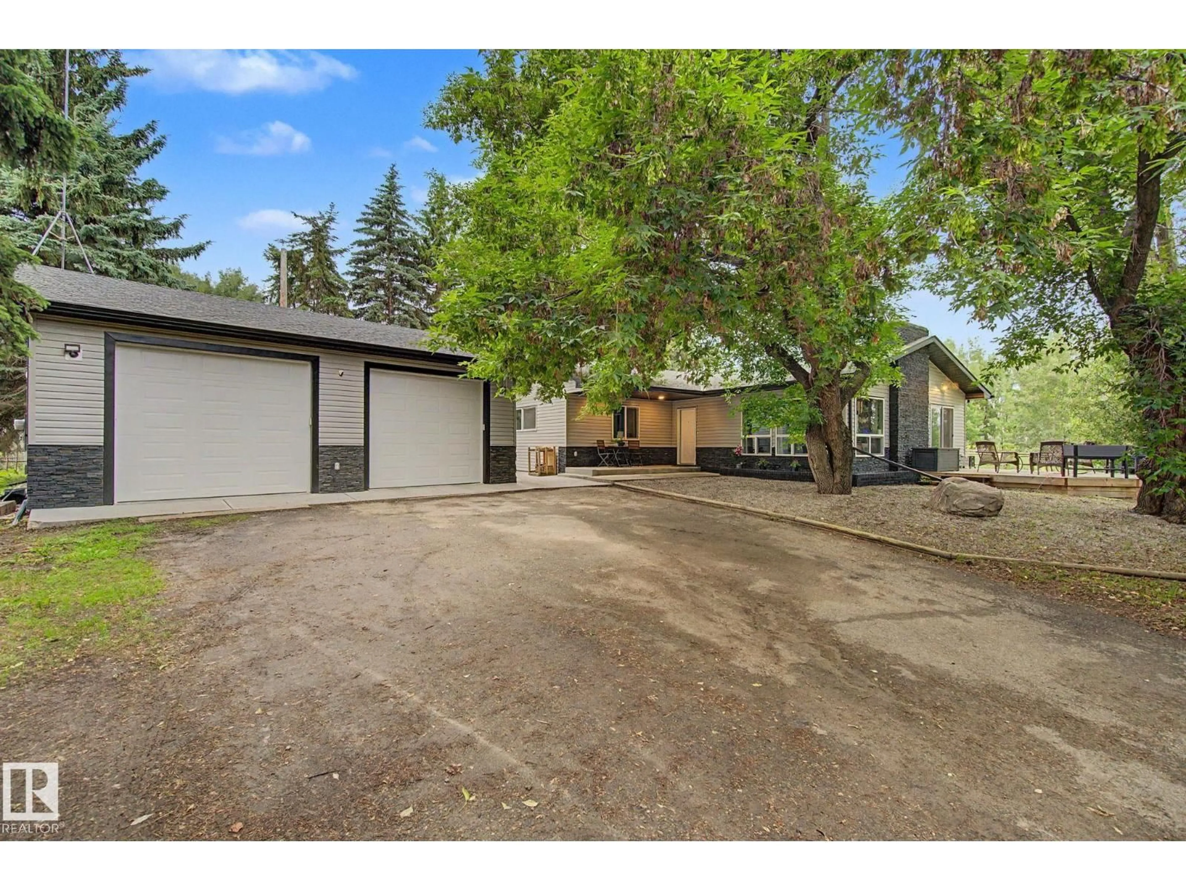 A pic from outside/outdoor area/front of a property/back of a property/a pic from drone, street for 52024 RGE ROAD 271, Rural Parkland County Alberta T7X3N1