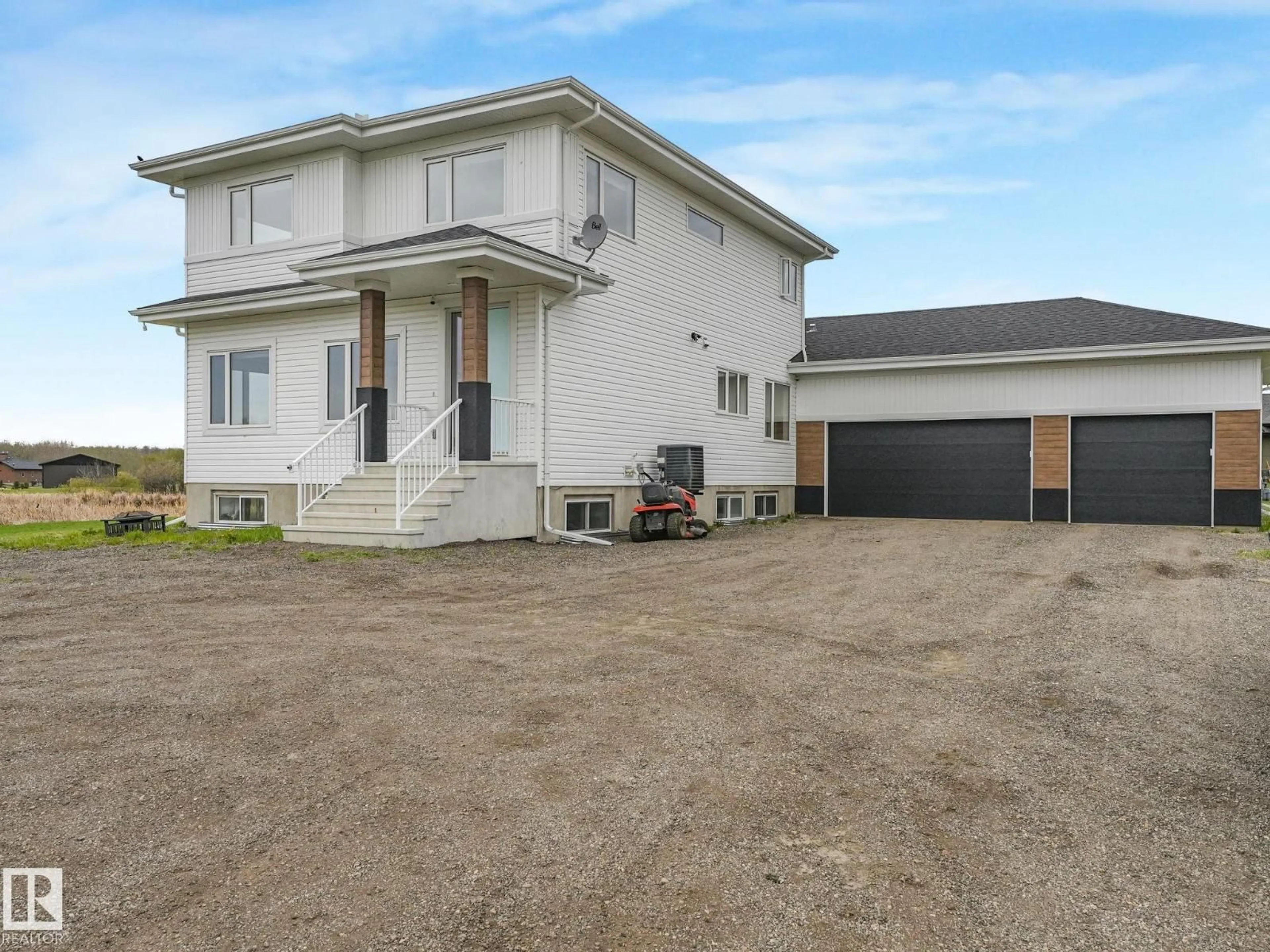 A pic from outside/outdoor area/front of a property/back of a property/a pic from drone, building for 60 23412 TWP RD 505, Rural Leduc County Alberta T4X0S1