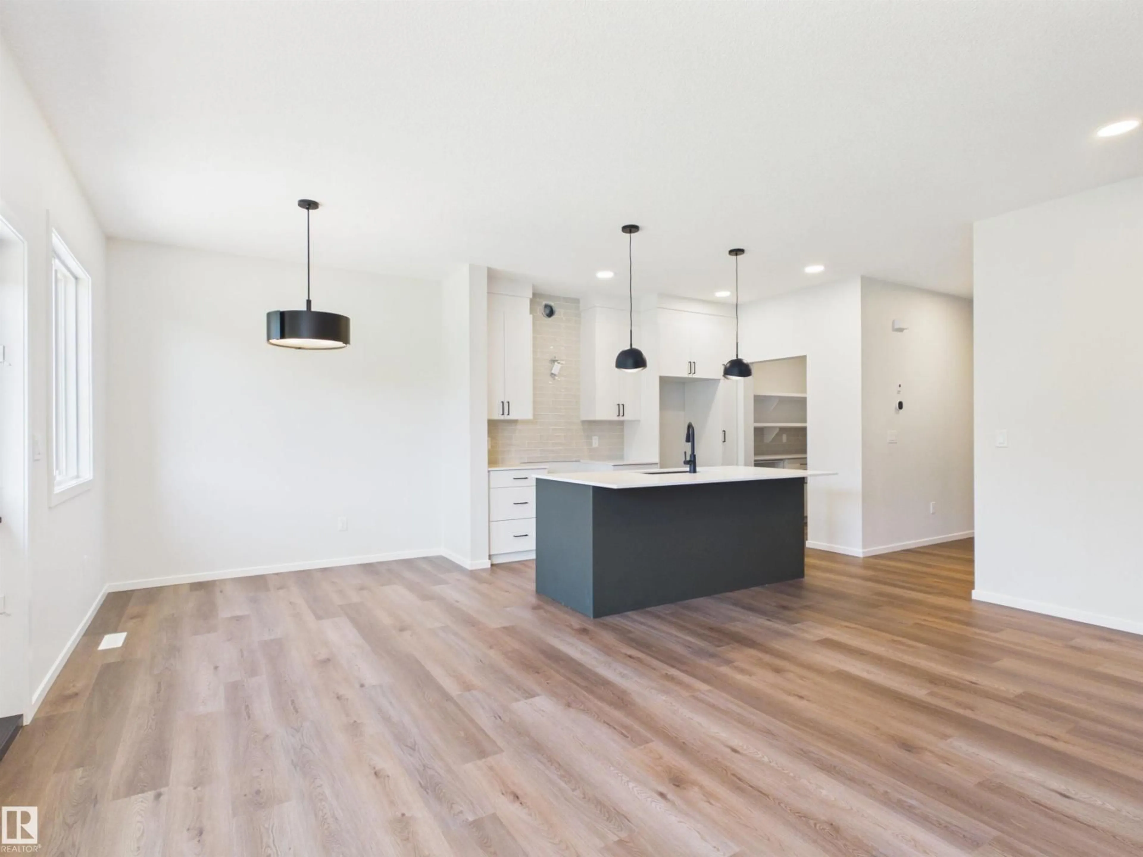 Open concept kitchen, wood/laminate floor for 119 HILTON CV, Spruce Grove Alberta T7X1Y4