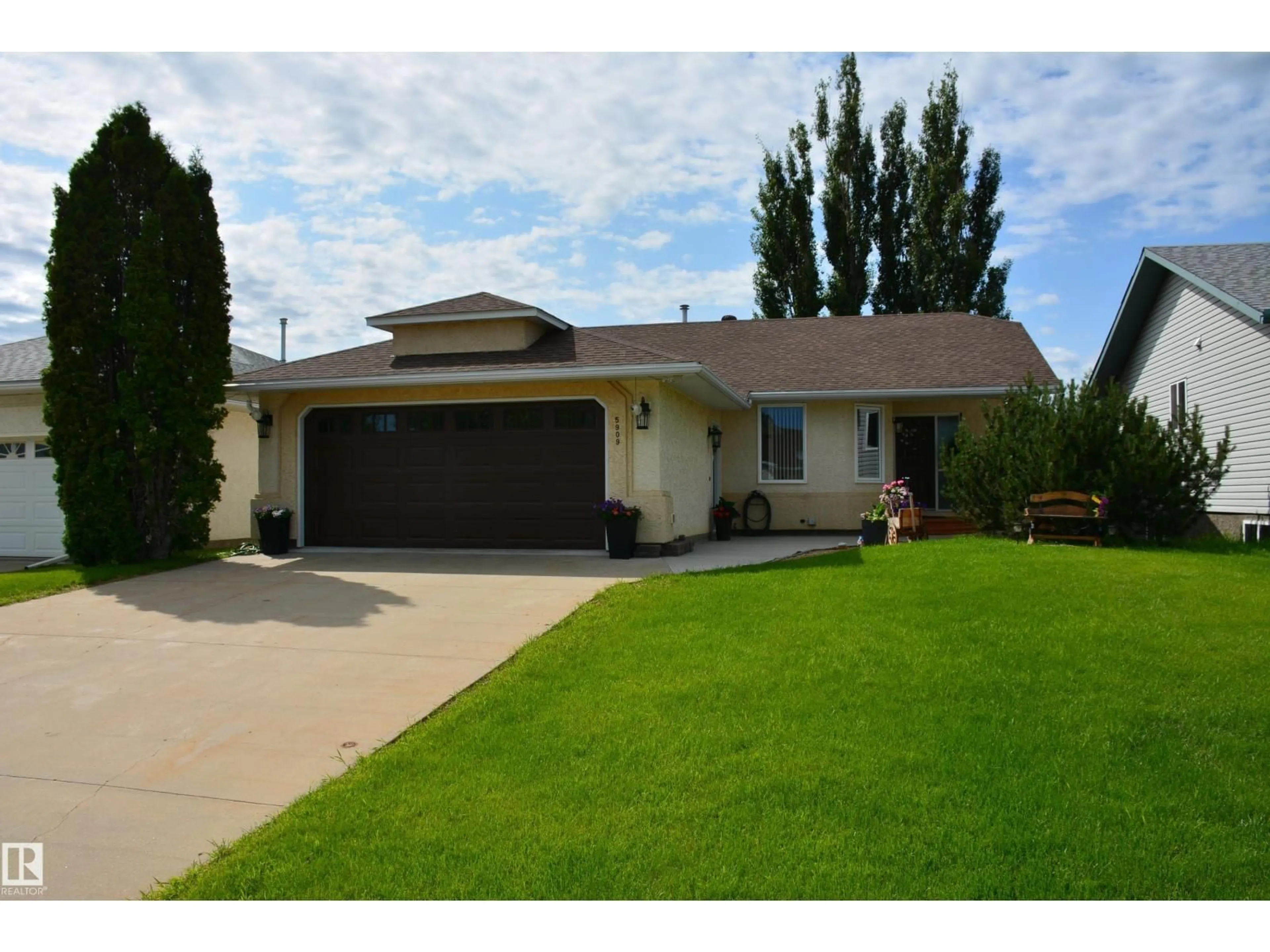 Home with vinyl exterior material, street for 5909 52 AV, Barrhead Alberta T7N1N6