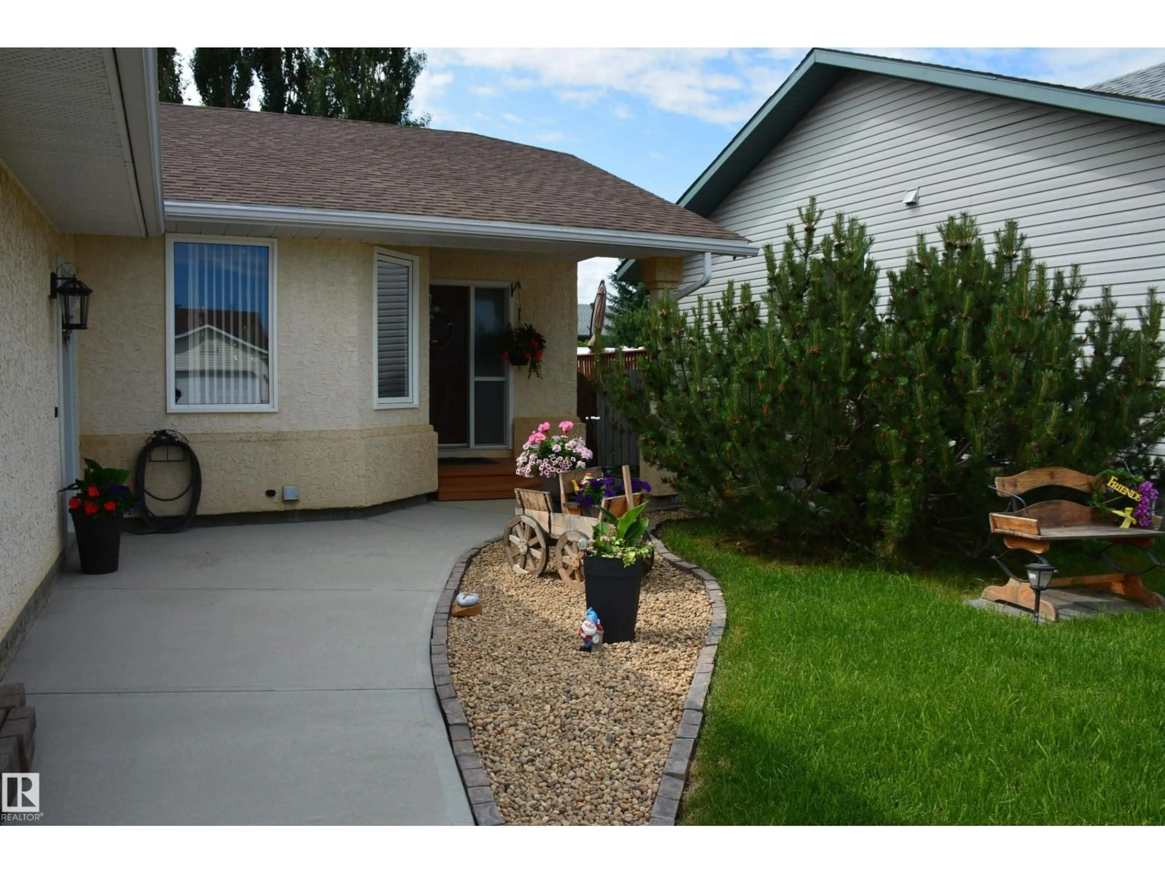 Home with vinyl exterior material, street for 5909 52 AV, Barrhead Alberta T7N1N6