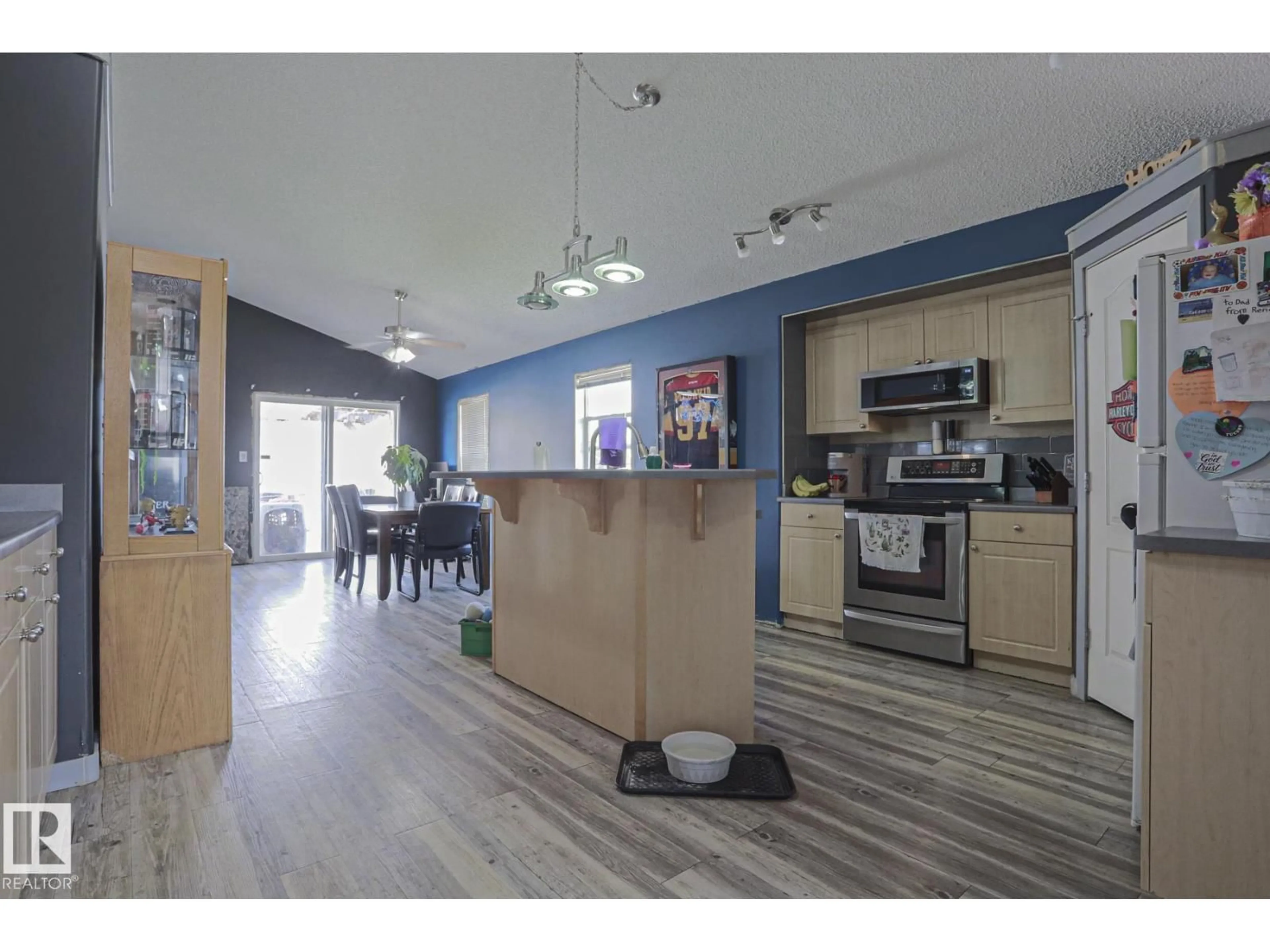 Open concept kitchen, wood/laminate floor for 4506 154 AV, Edmonton Alberta T5Y3H3