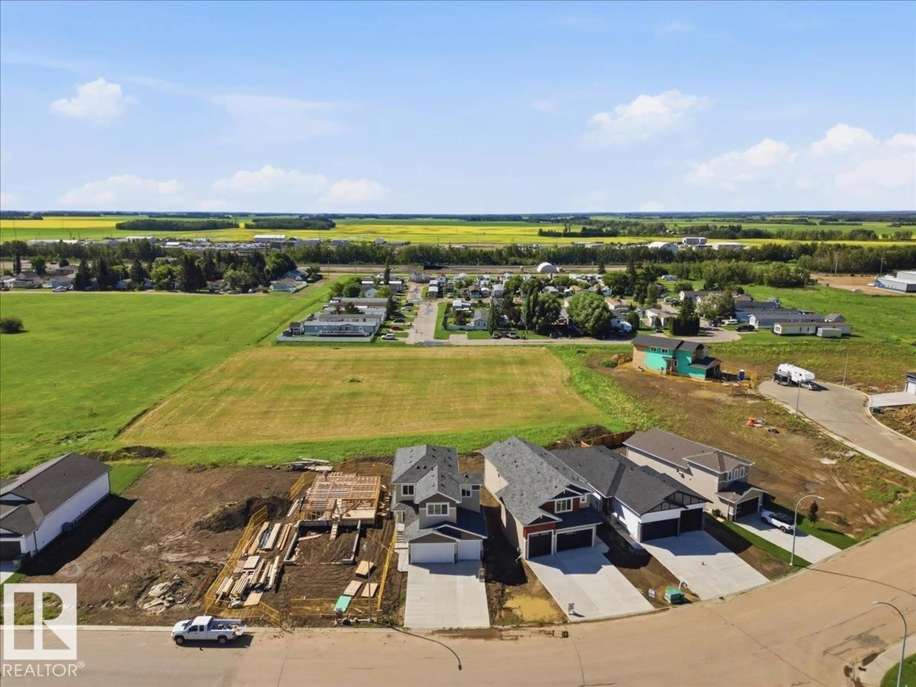 A pic from outside/outdoor area/front of a property/back of a property/a pic from drone, water/lake/river/ocean view for 5221 47 AVE, Calmar Alberta T0C0V0