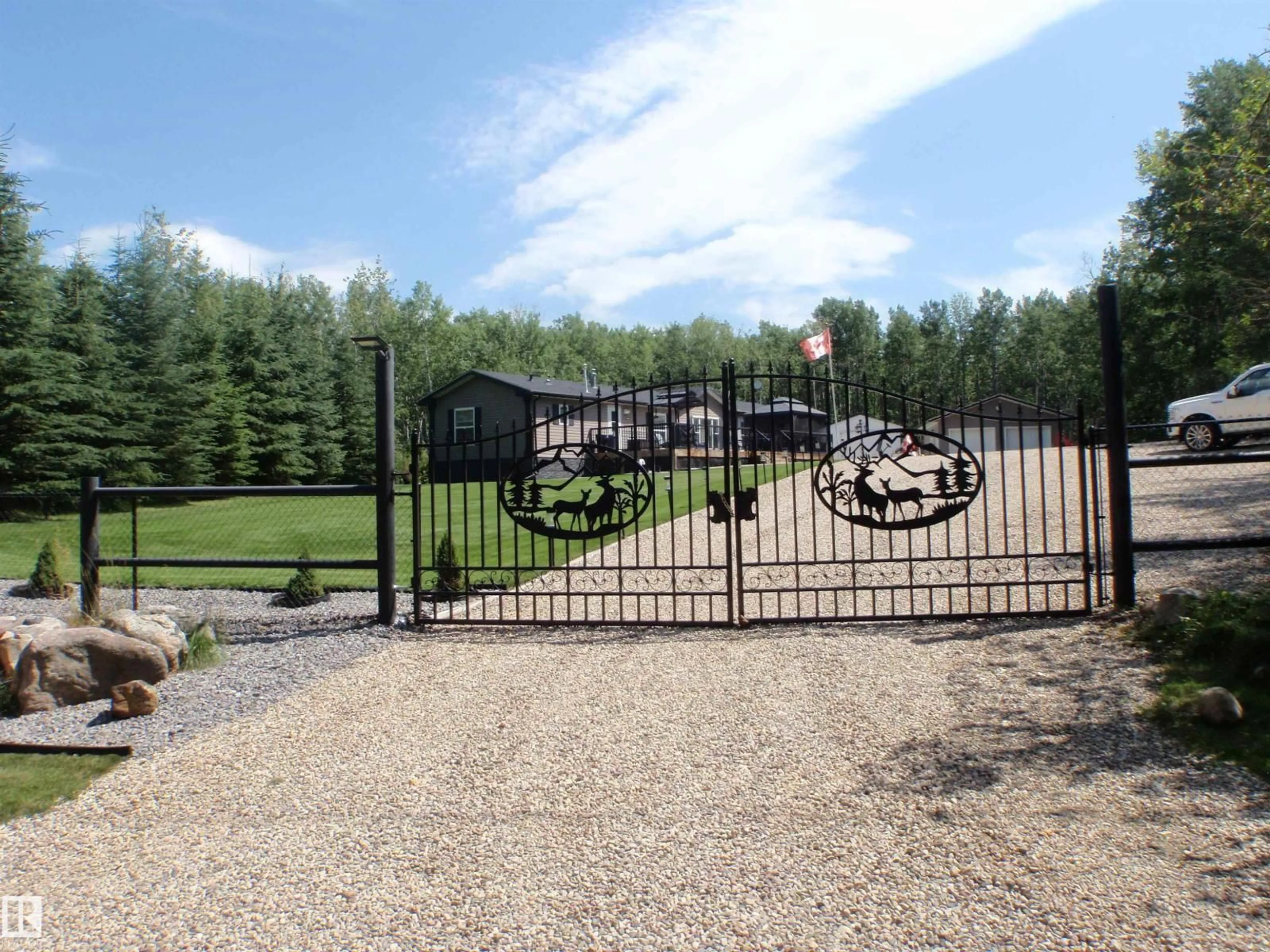 A pic from outside/outdoor area/front of a property/back of a property/a pic from drone, mountain view for 59316 - 68 RGE RD 54, Rural Barrhead County Alberta T7N1N3