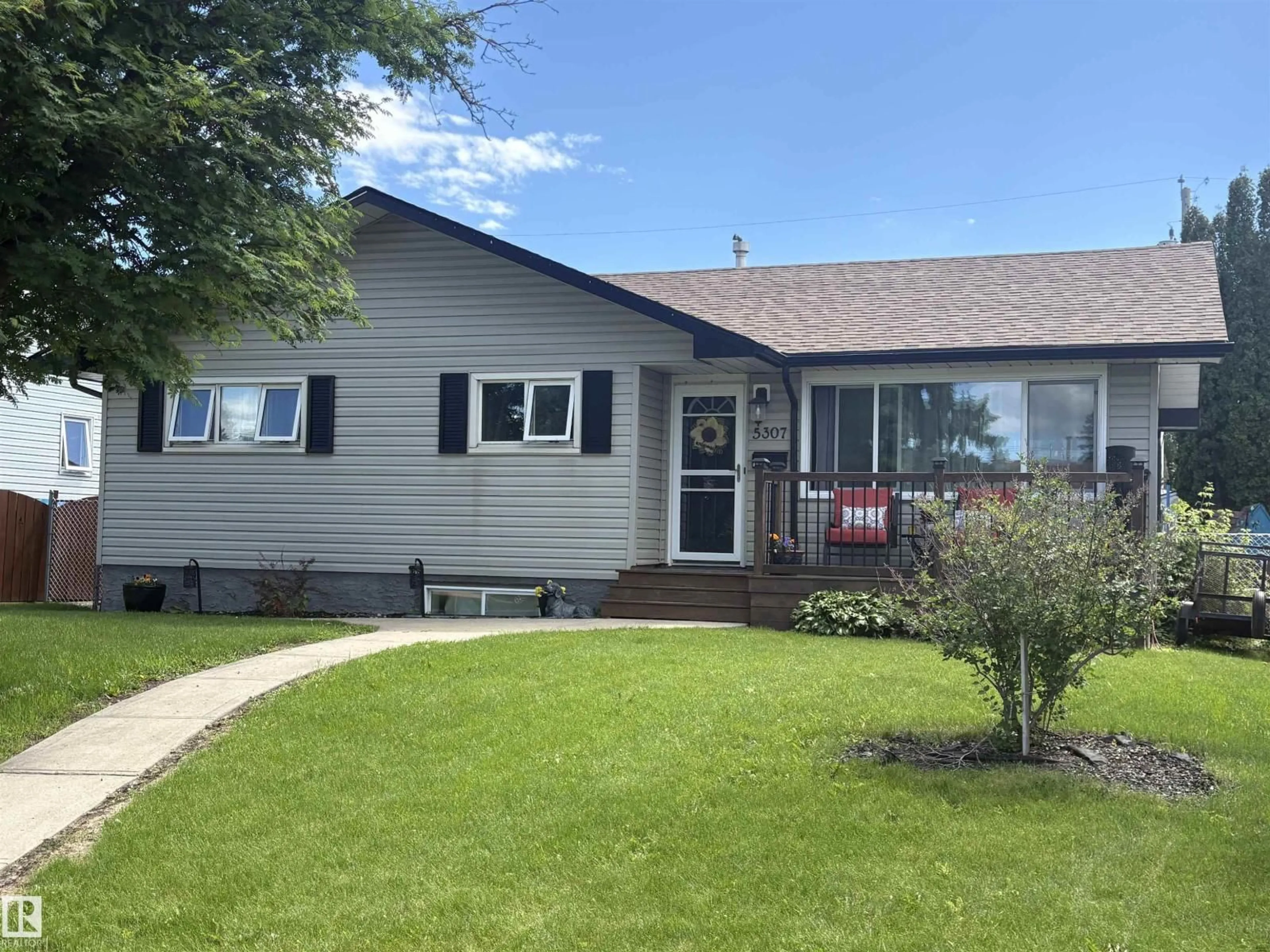 Home with vinyl exterior material, street for 5307 104 AV, Edmonton Alberta T6A0X7
