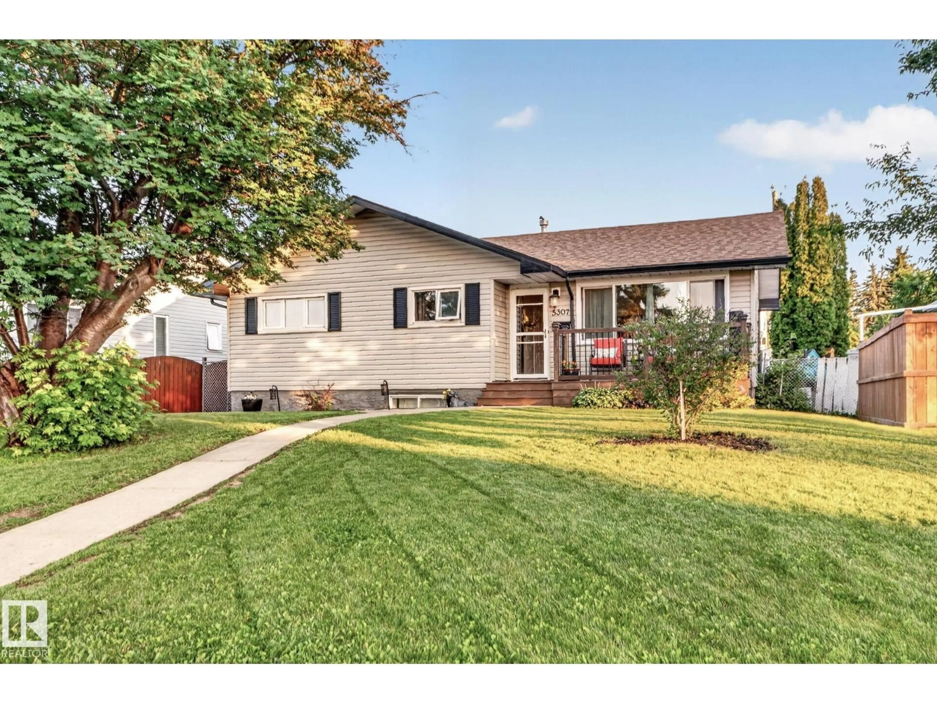 Home with vinyl exterior material, street for 5307 104 AV, Edmonton Alberta T6A0X7