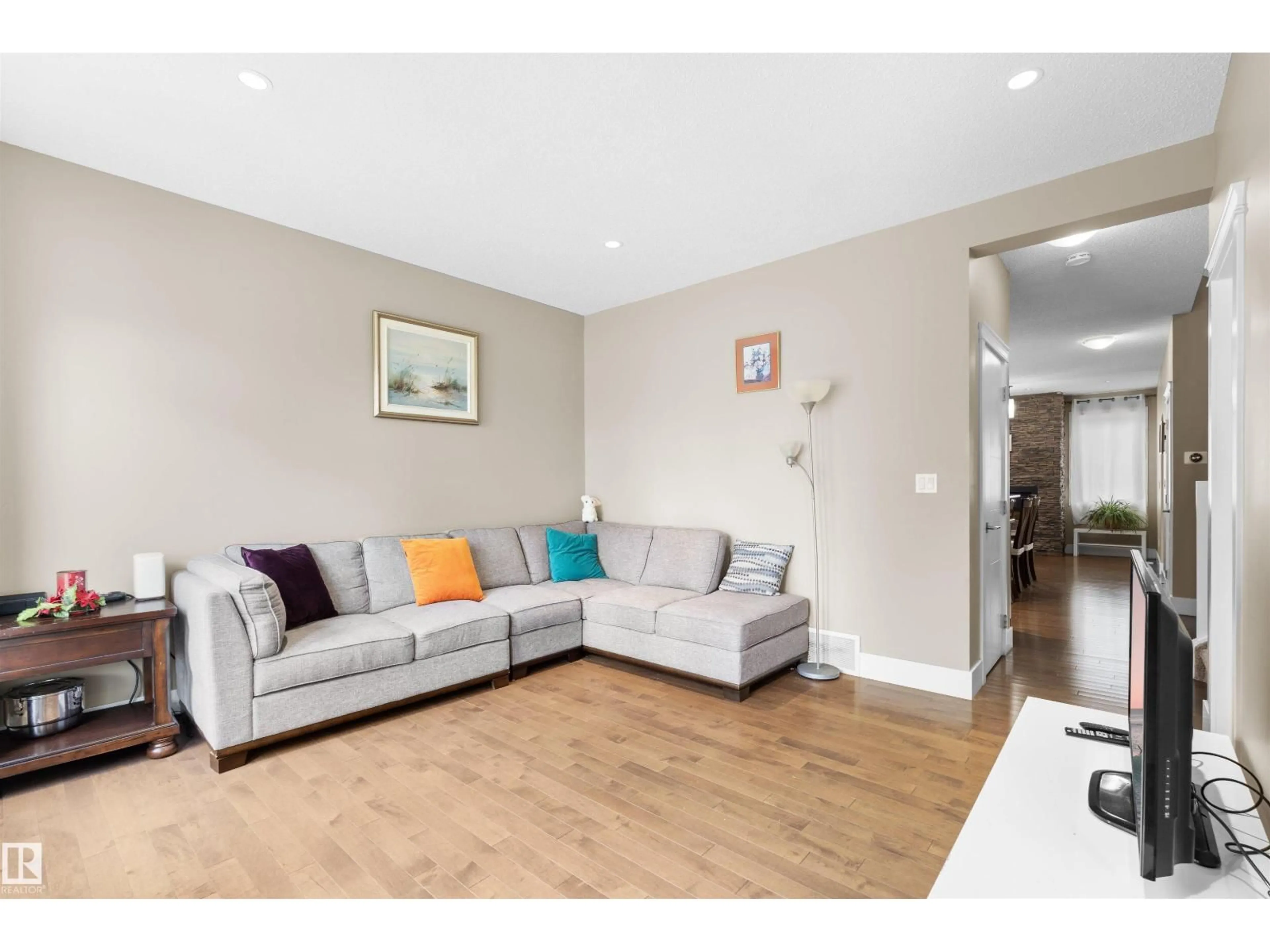Living room with furniture, wood/laminate floor for 11719 127 ST, Edmonton Alberta T5M0V8