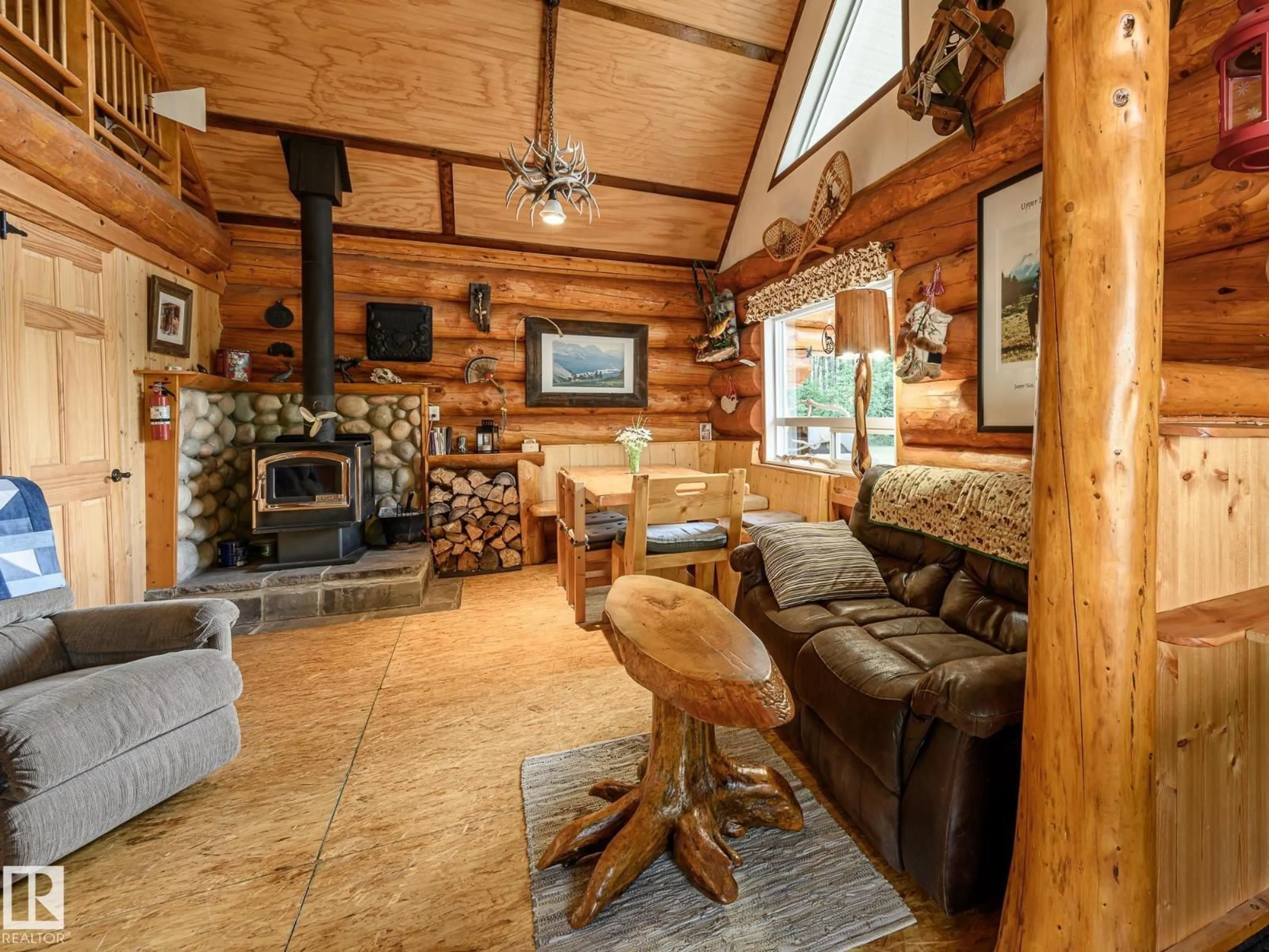 Living room with furniture, wood/laminate floor for A - 58227 RANGE RD 70, Rural St. Paul County Alberta T0A0G1