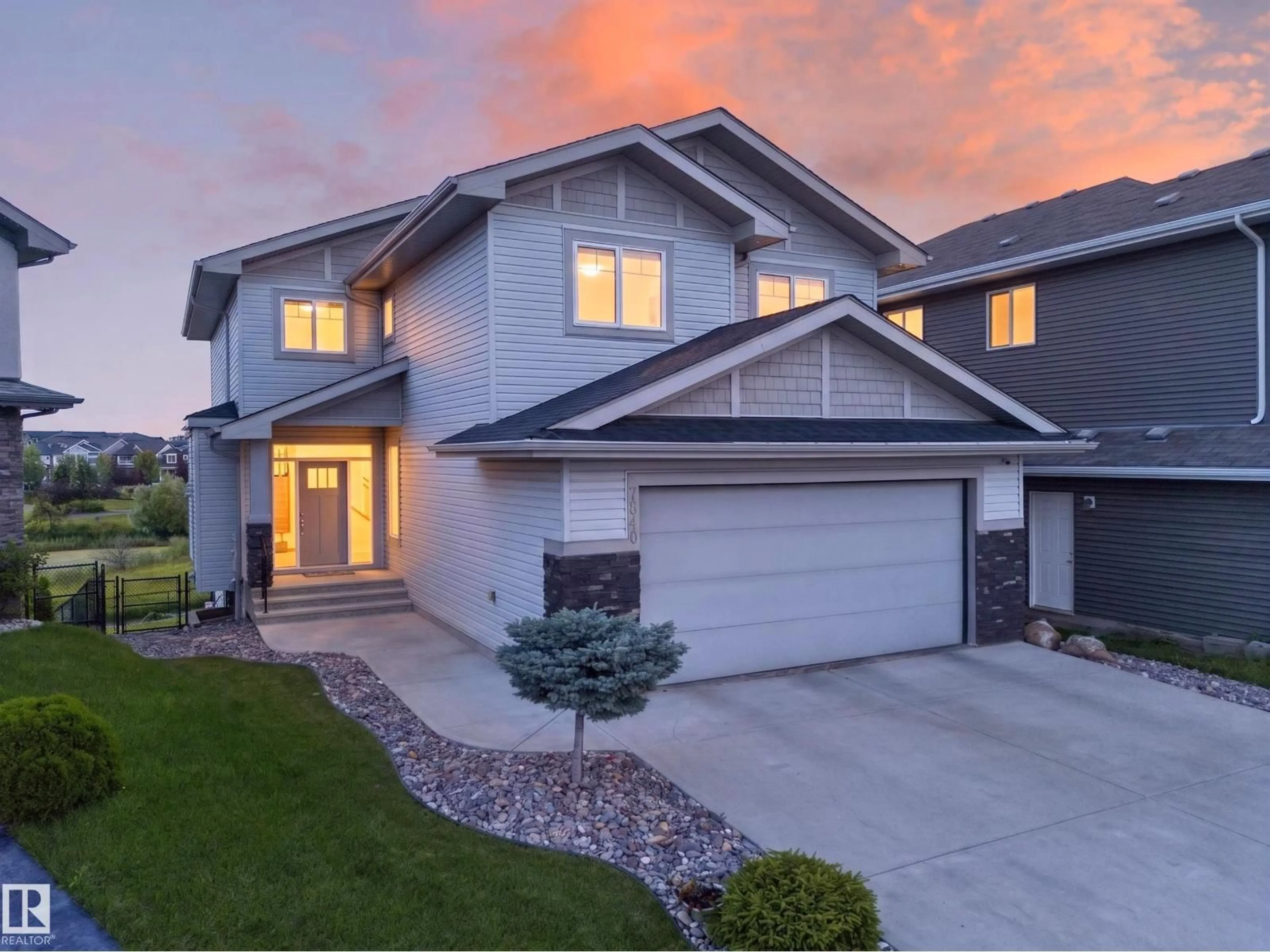 Home with vinyl exterior material, street for NW - 7640 179 AV, Edmonton Alberta T5Z0L2