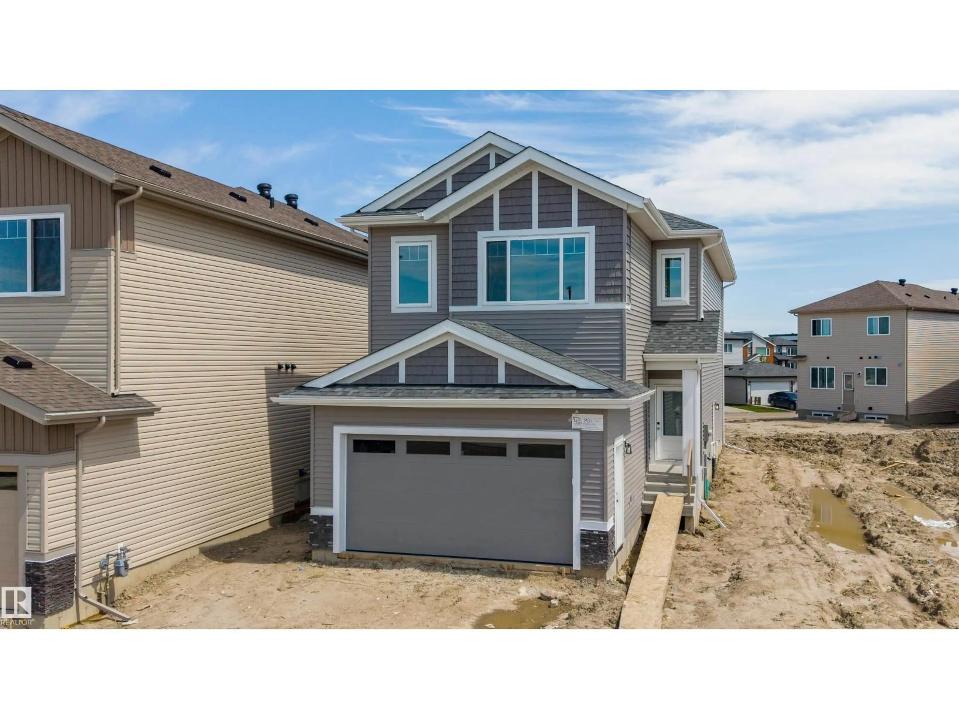 Home with vinyl exterior material, street for 415 MUNN CO, Leduc Alberta T9E0J9