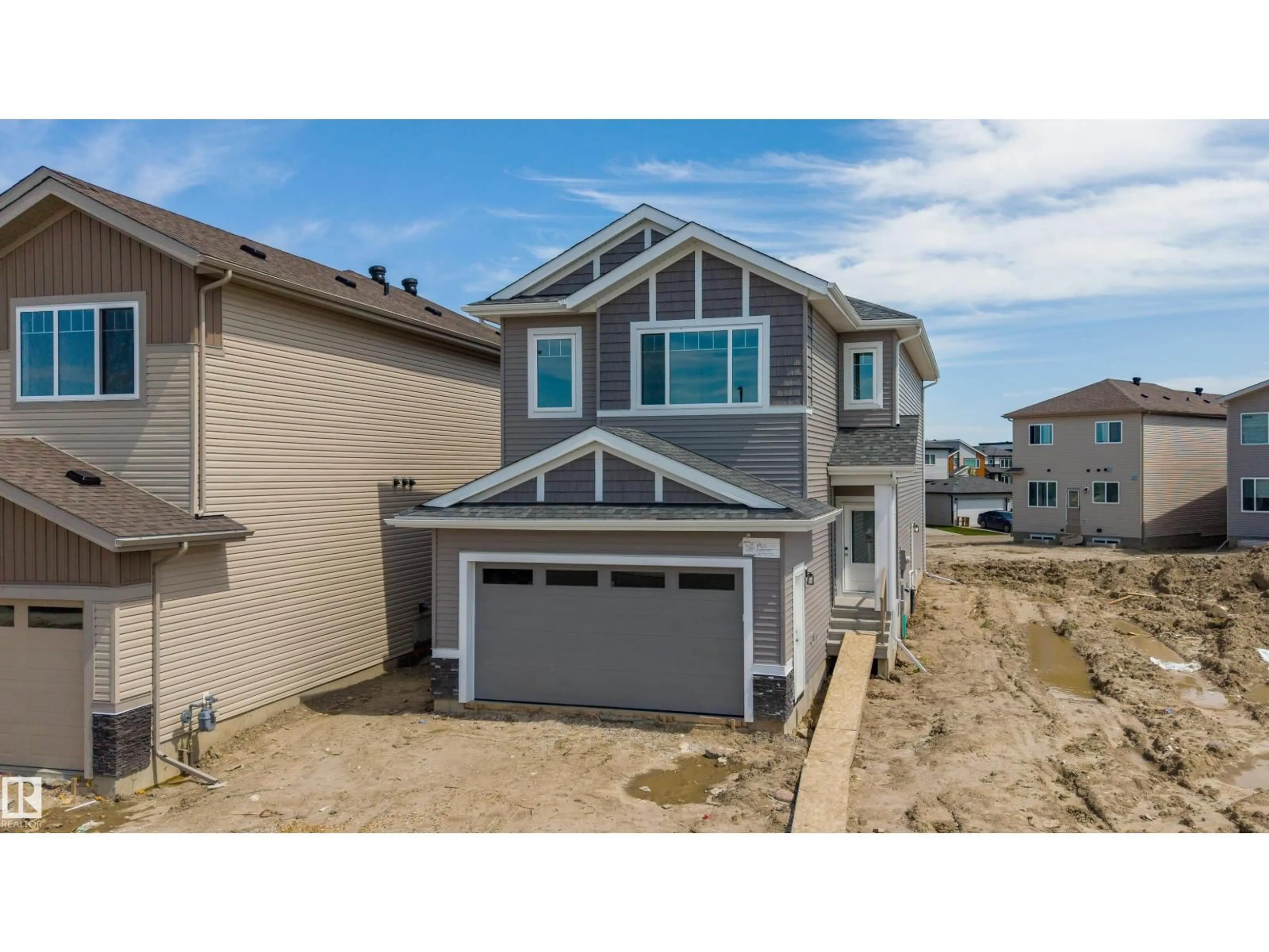 Home with vinyl exterior material, street for 415 MUNN CO, Leduc Alberta T9E0J9