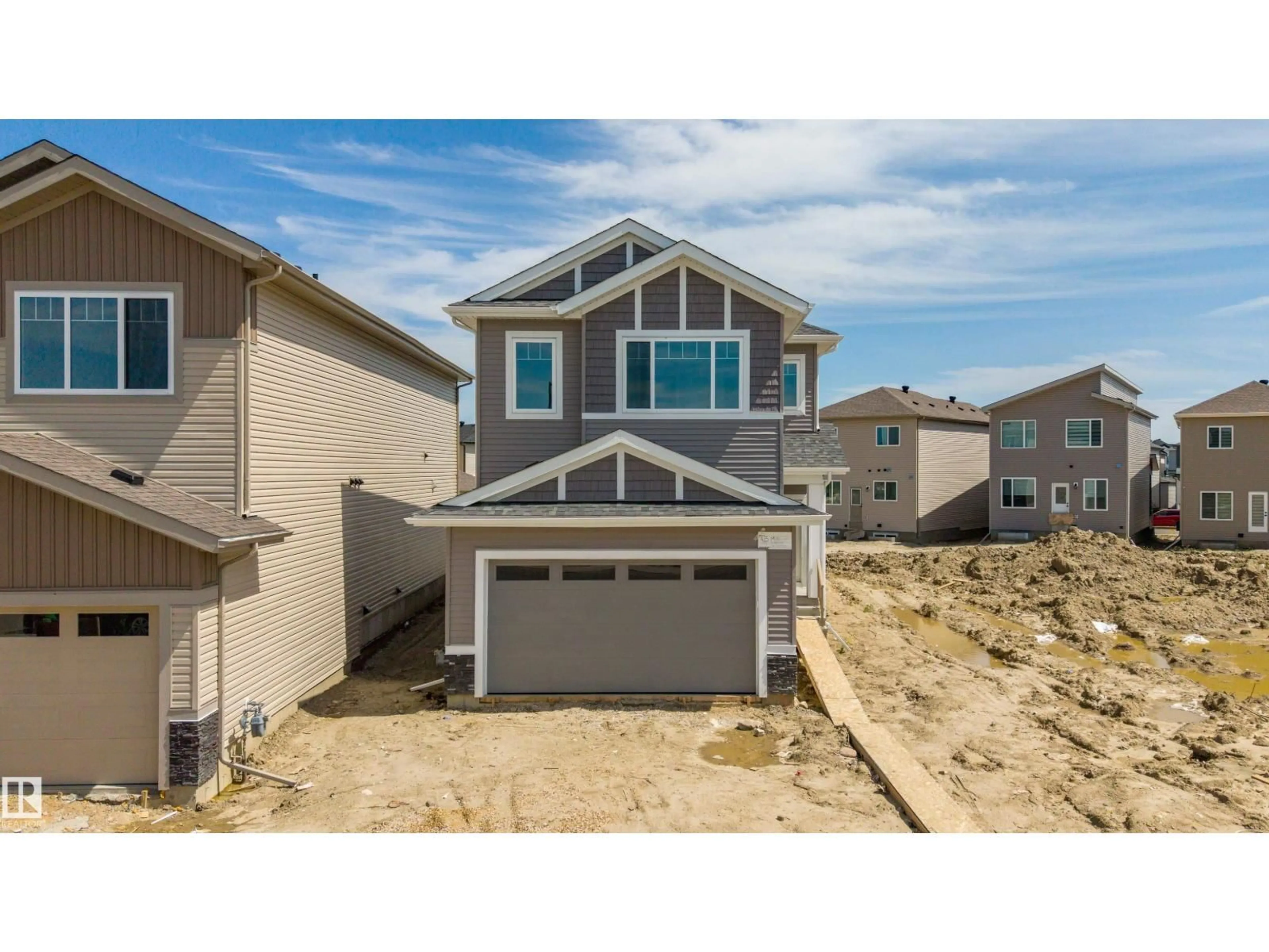 Home with vinyl exterior material, street for 415 MUNN CO, Leduc Alberta T9E0J9