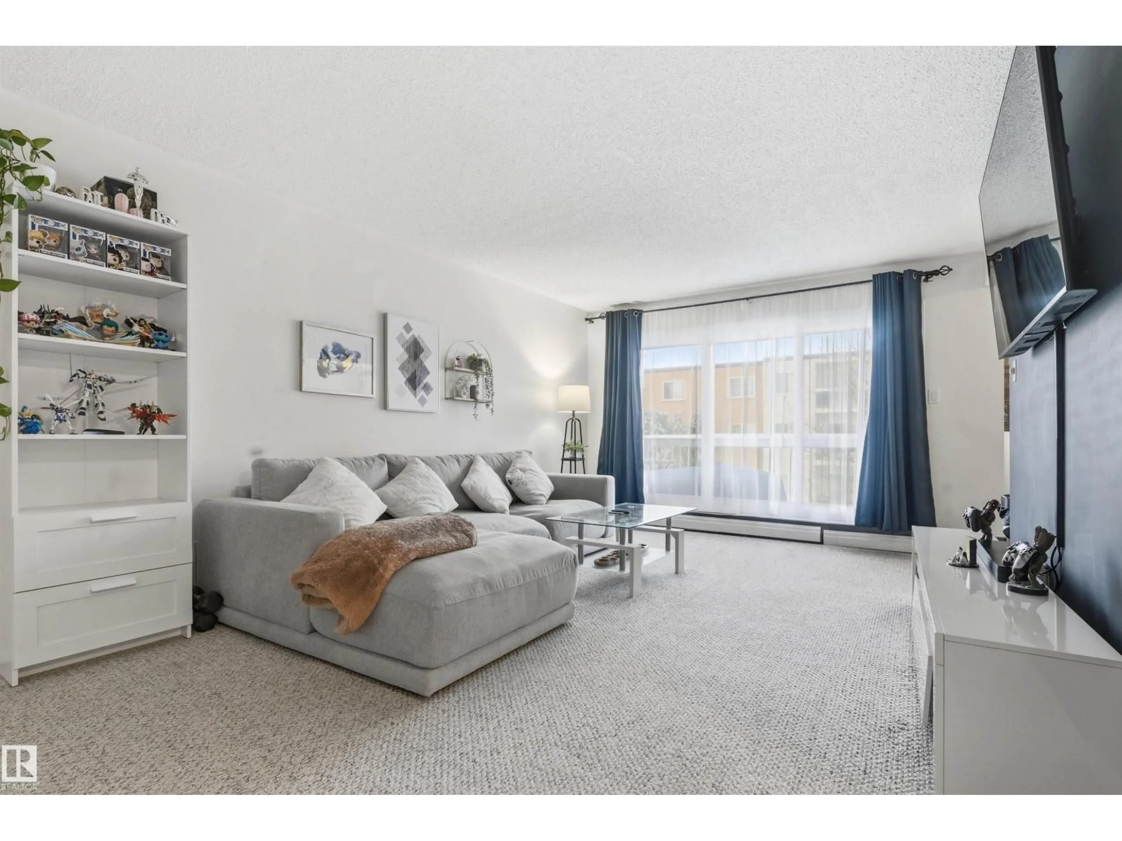 Living room with furniture, unknown for 205 - 11440 40 AVENUE NW, Edmonton Alberta T6J0R5